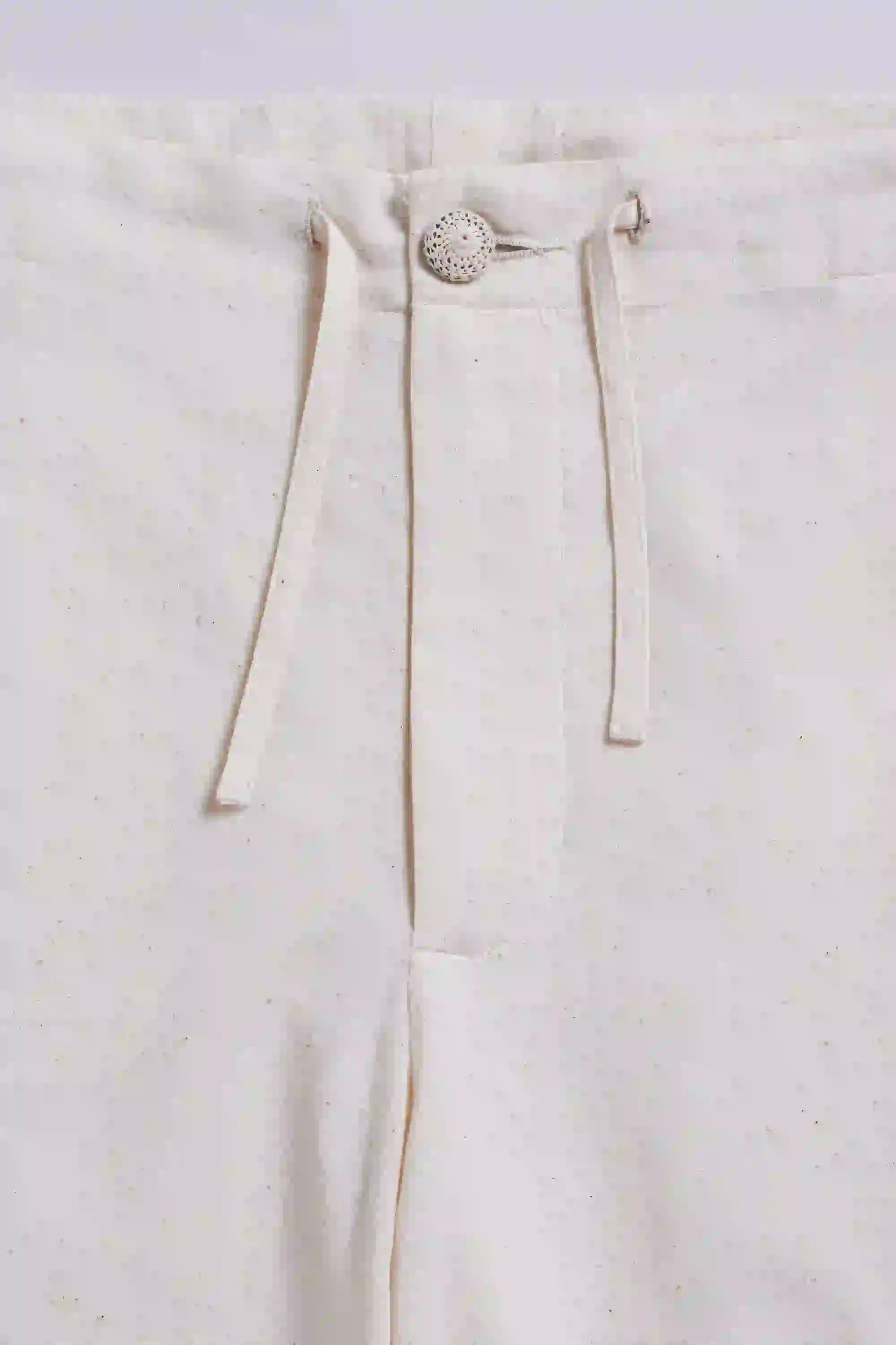 Fabric close-up with button and drawstring