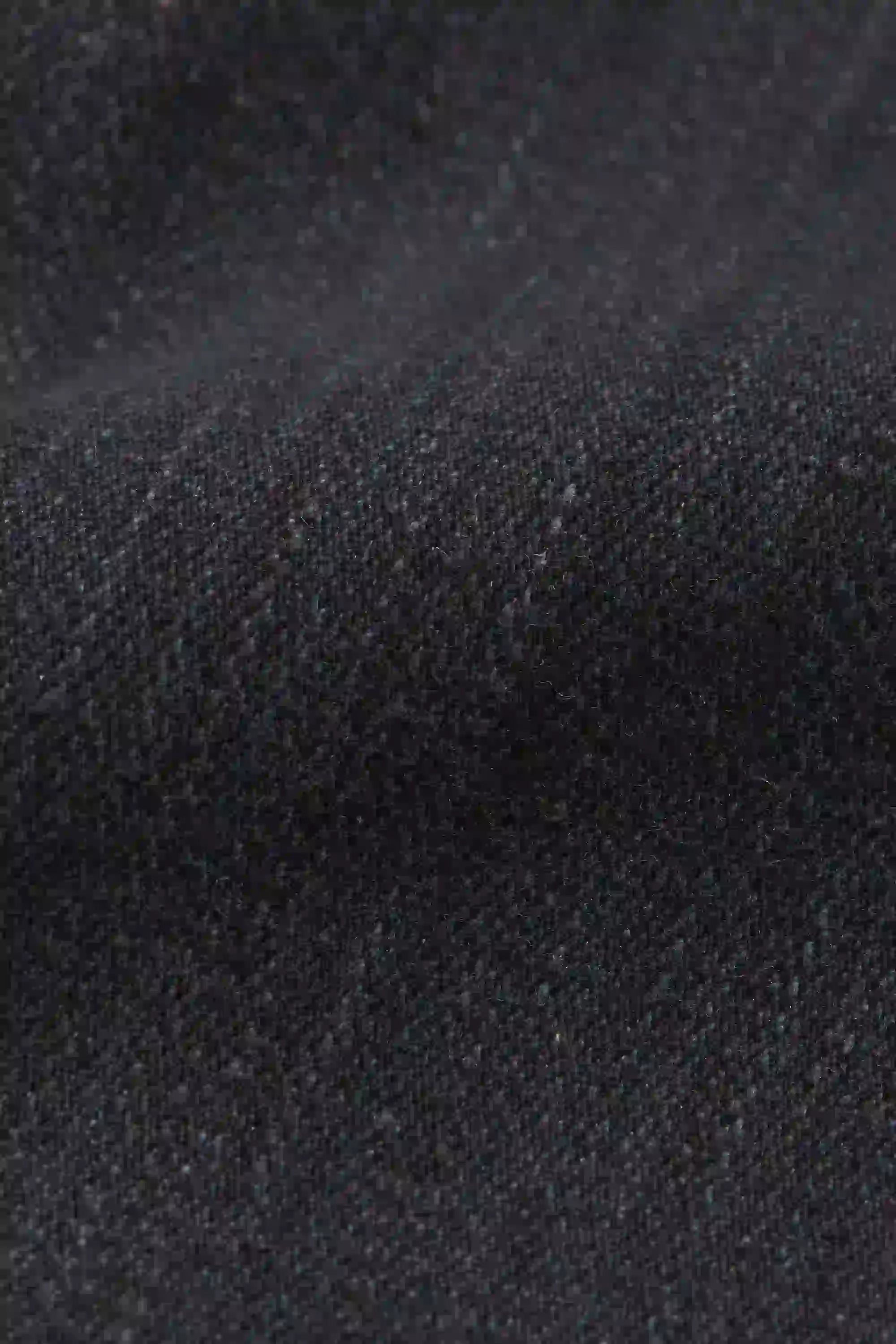 Close-up of dark denim fabric texture