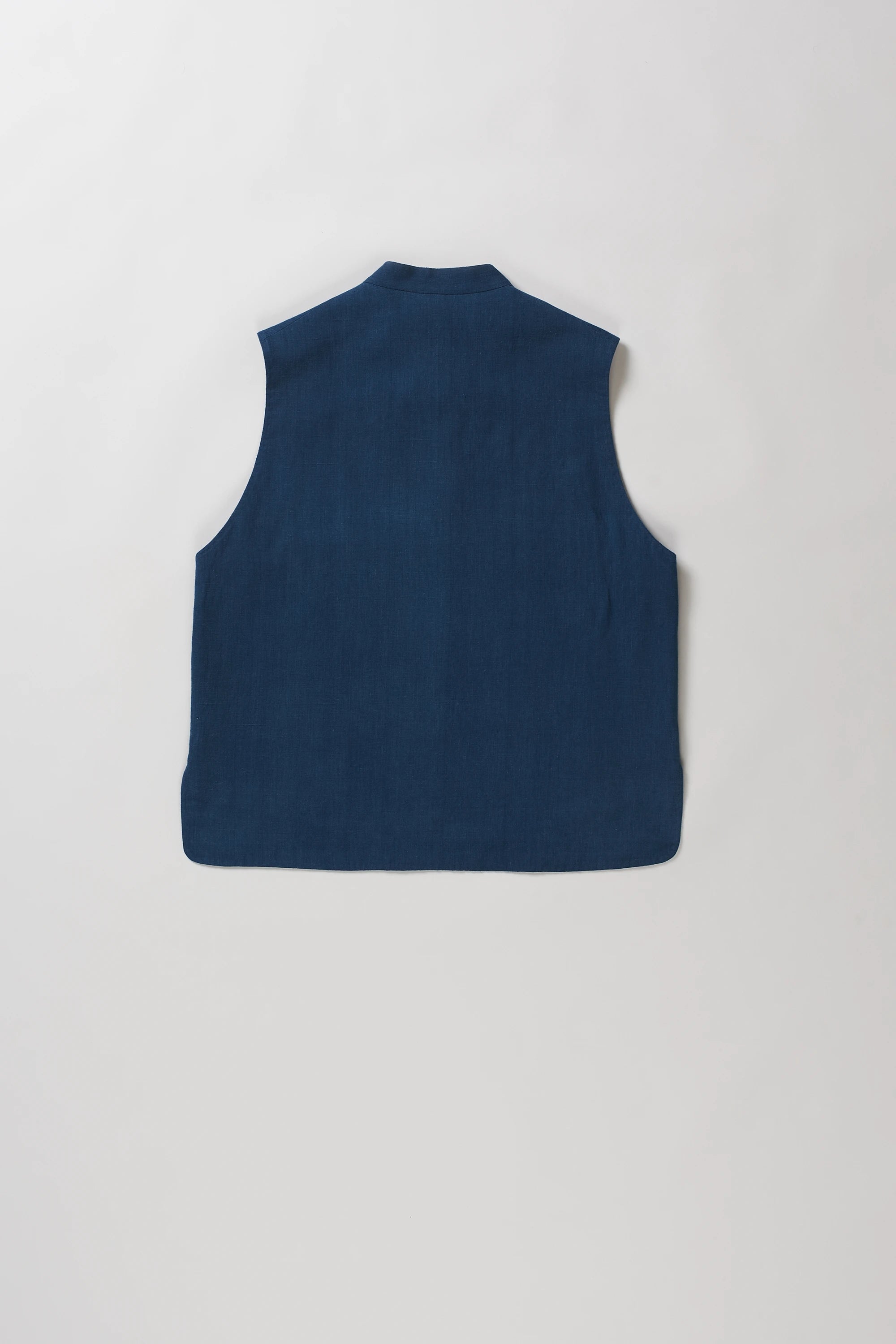 Back shot of sleeveless space blue vest.