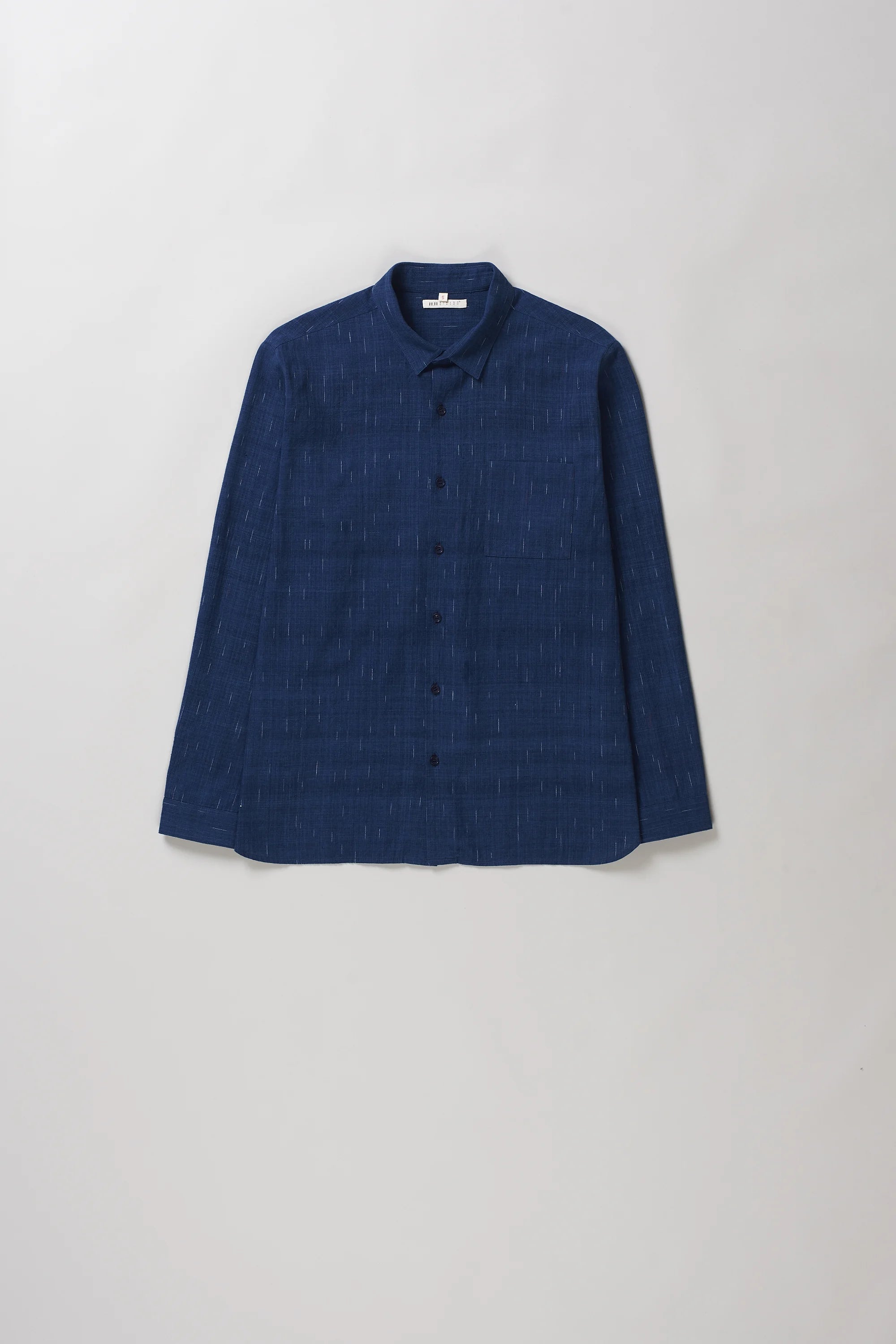 Front image of medium indigo cotton shirt