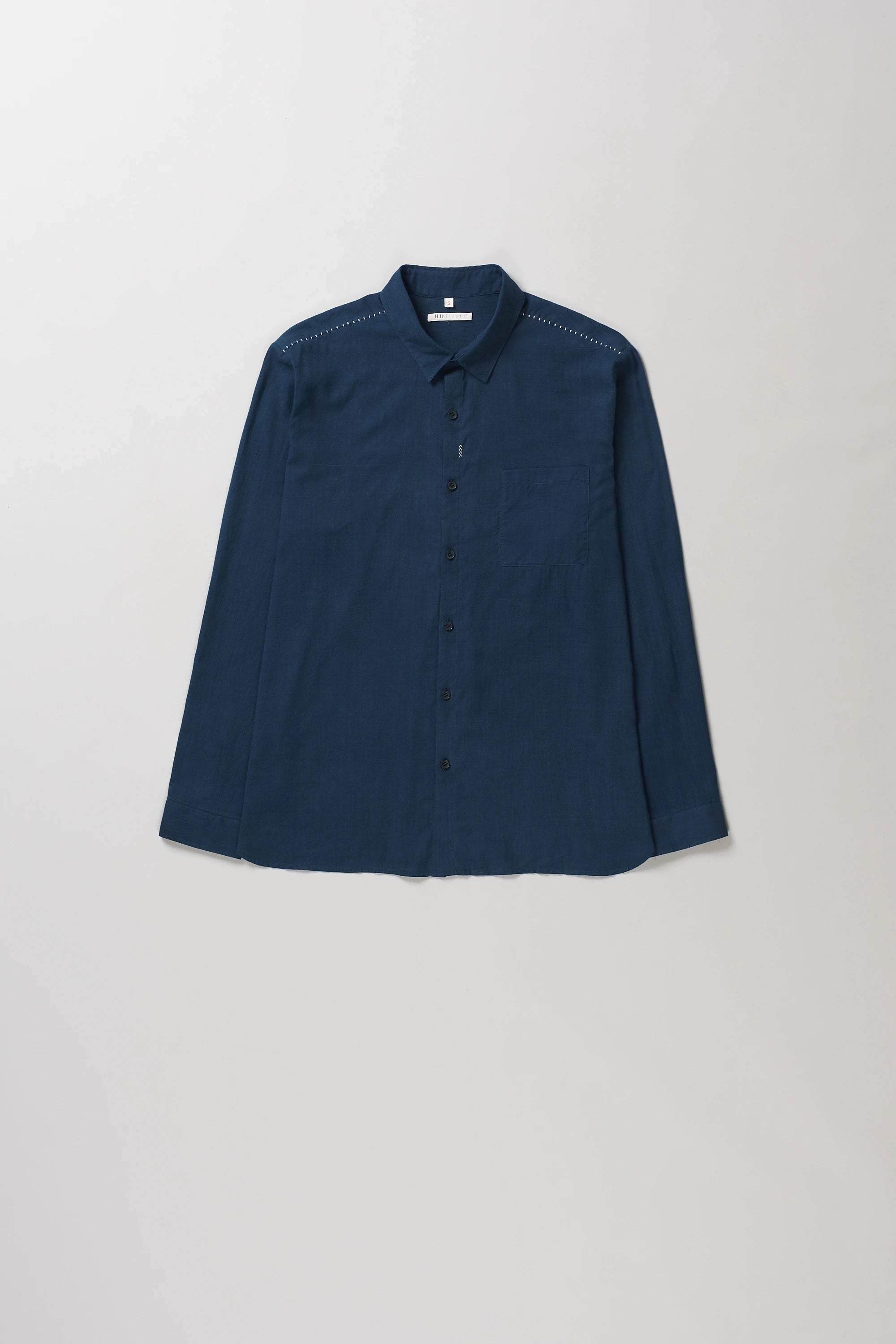 Front image of space blue cotton shirt with hand details