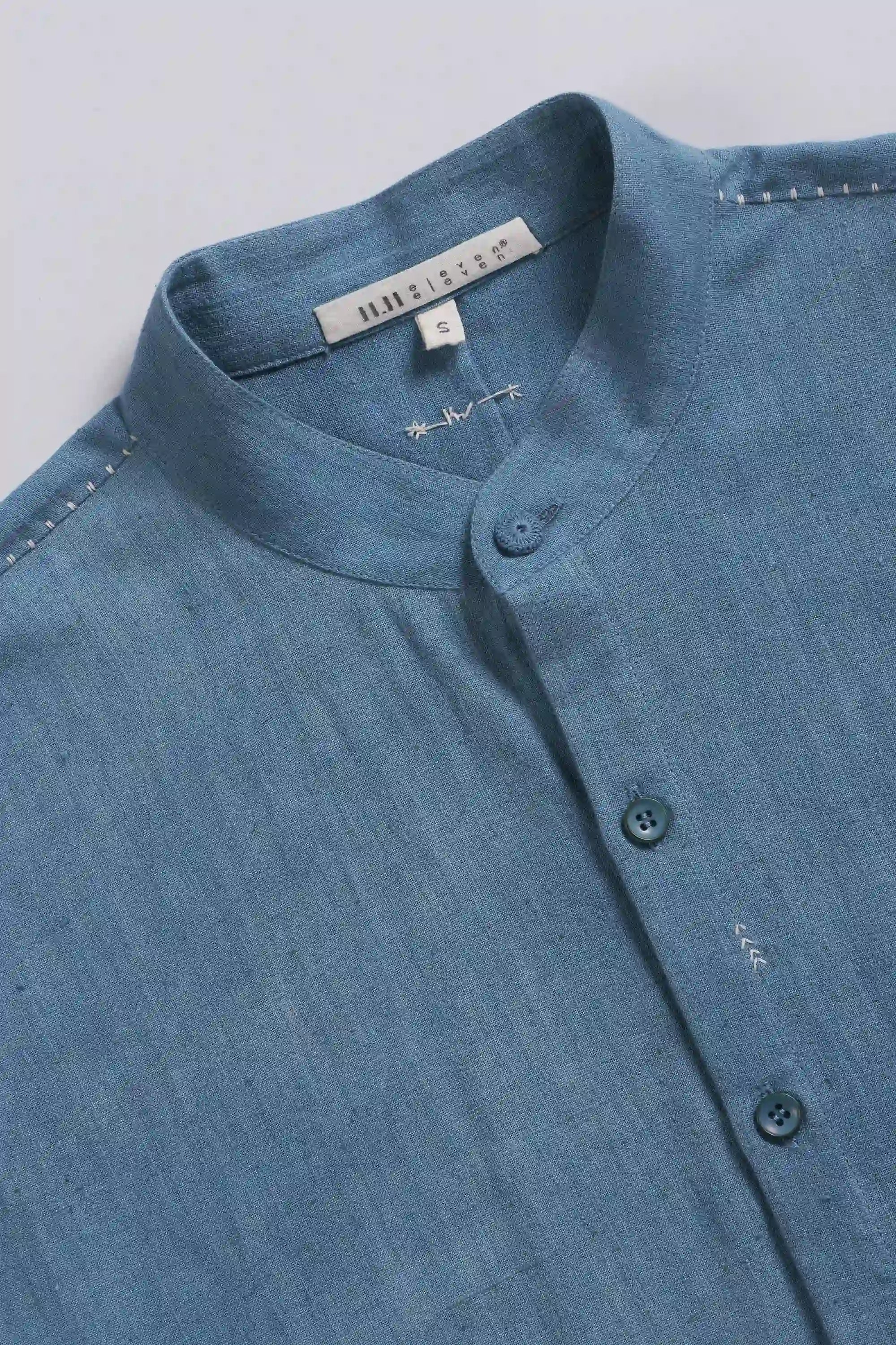 Fabric close-up with band collar and buttons 