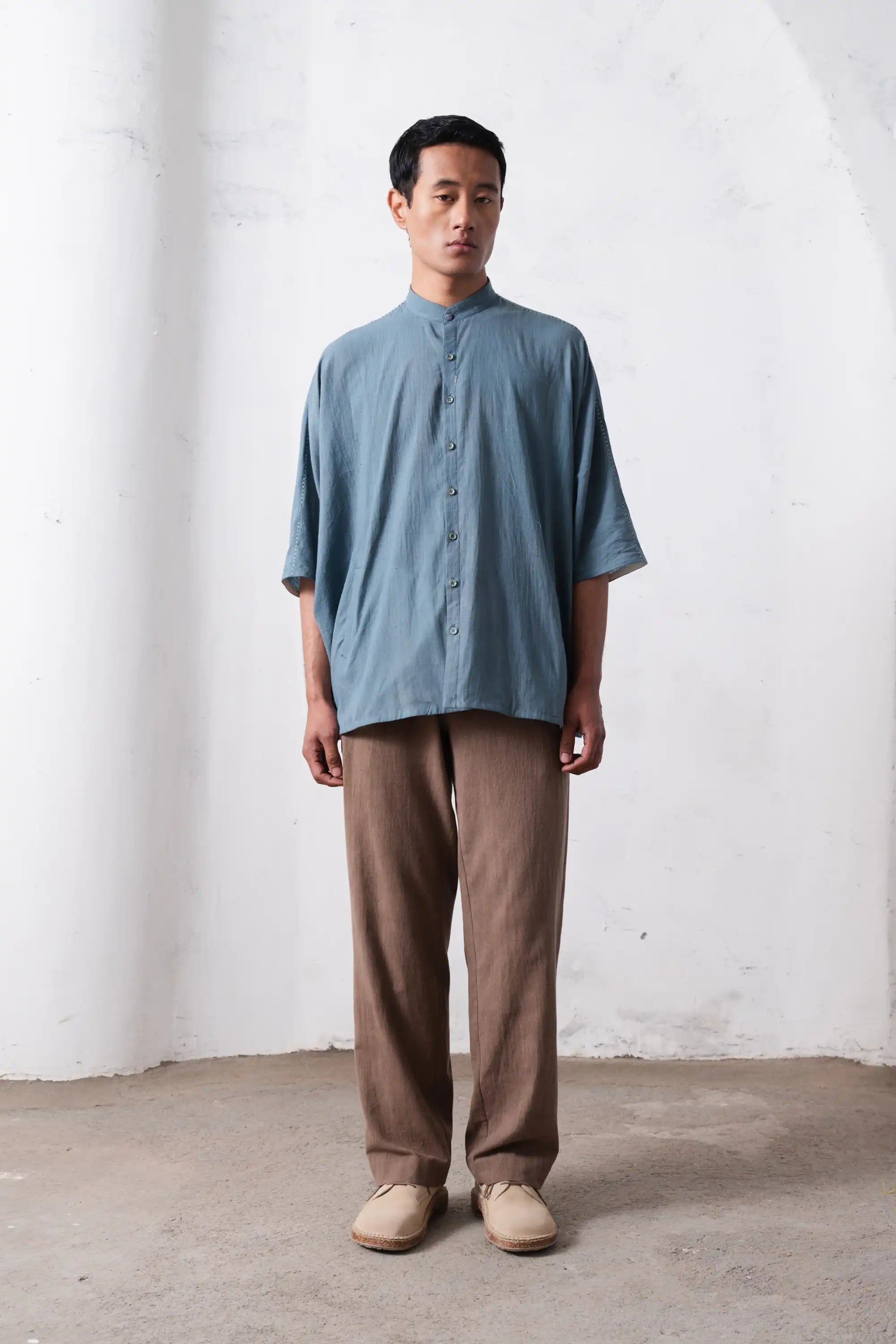 A man wearing powder blue shirt