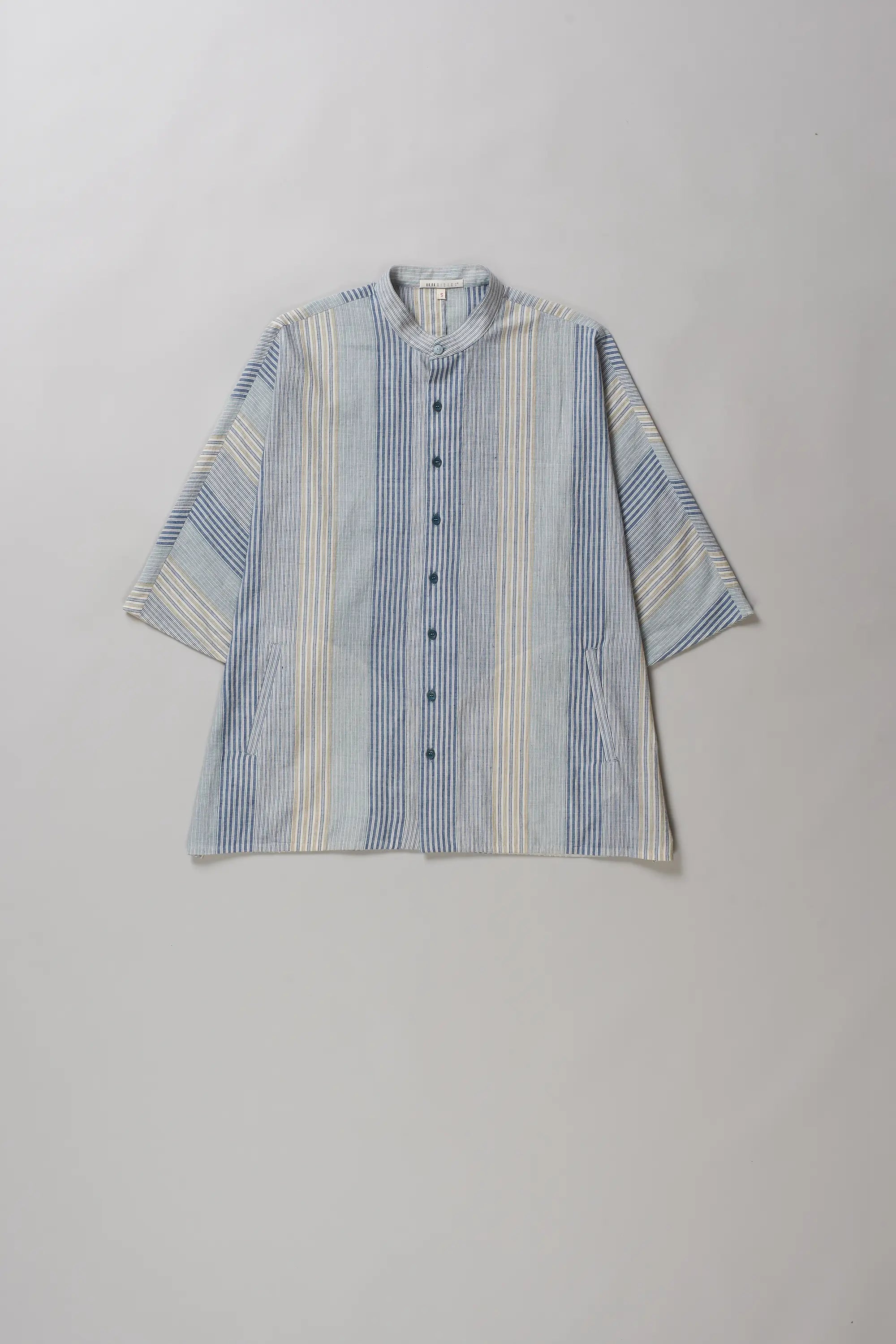 A short-sleeve button-up shirt with multi colour and off-white stripes, featuring a mandarin collar and buttons
