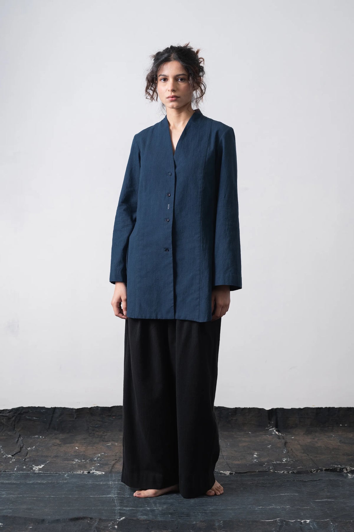 A woman wearing cotton space blue shirt