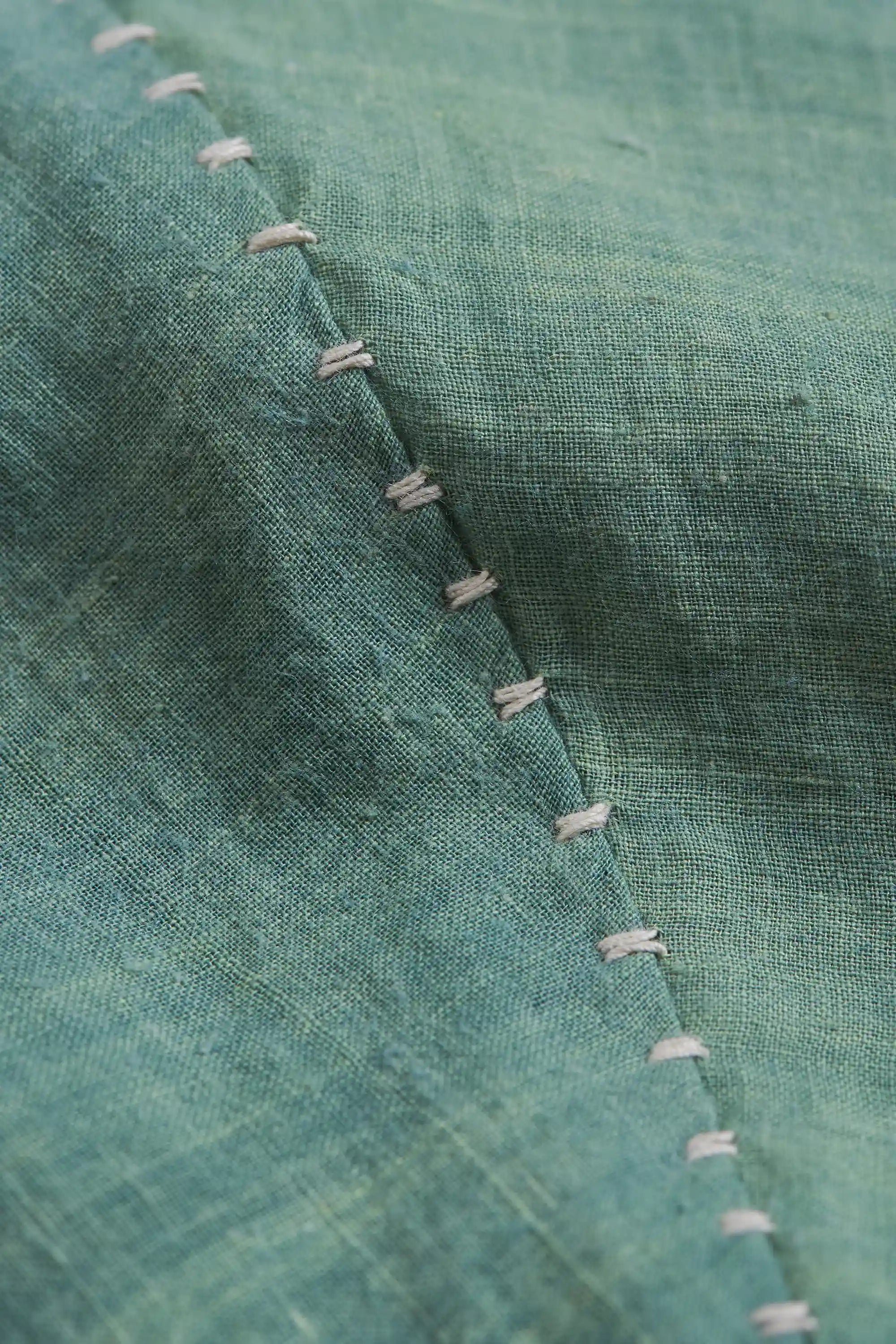 Close-up of fabric with hand detailing