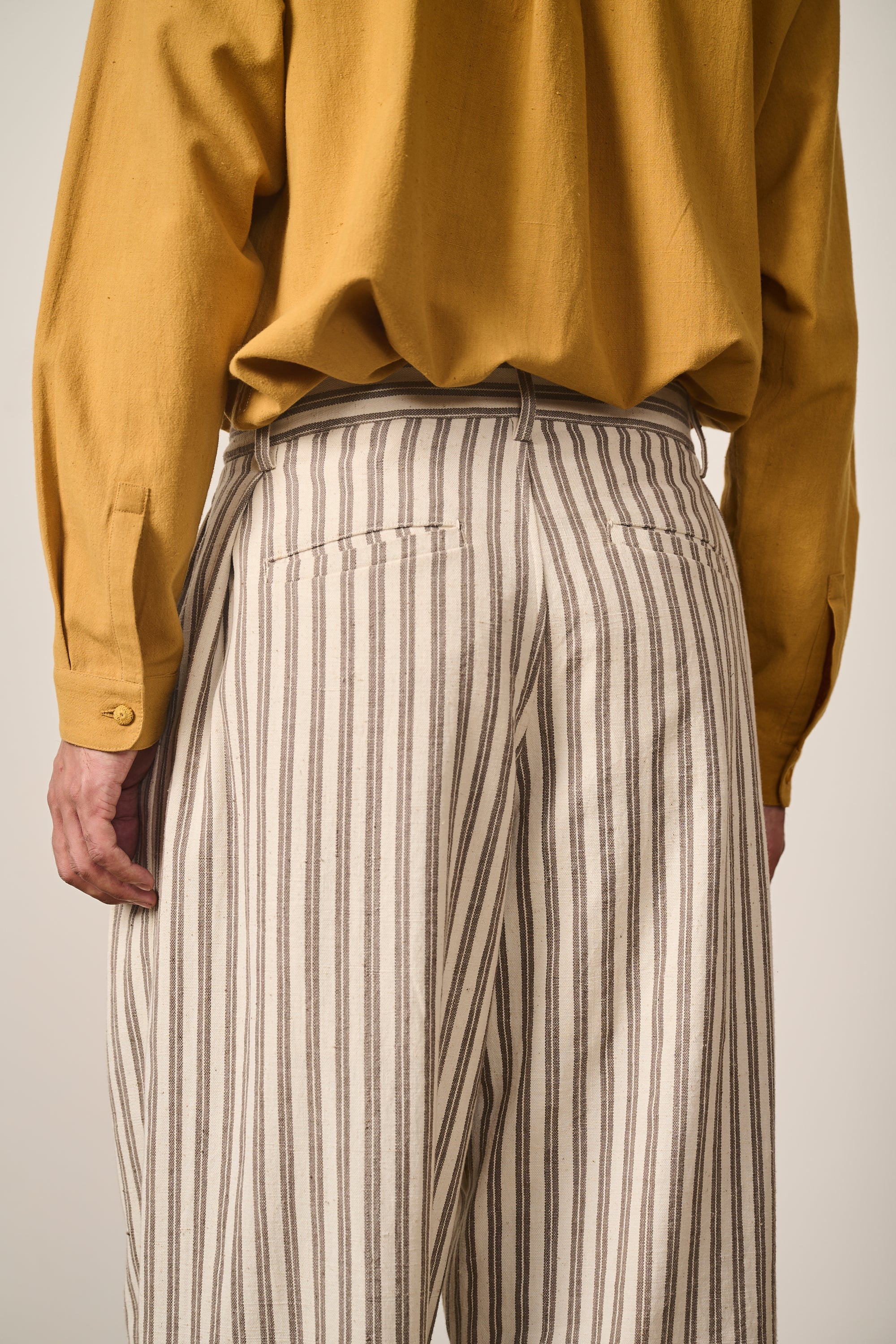 YARN DYED COTTON PLEATED TROUSER