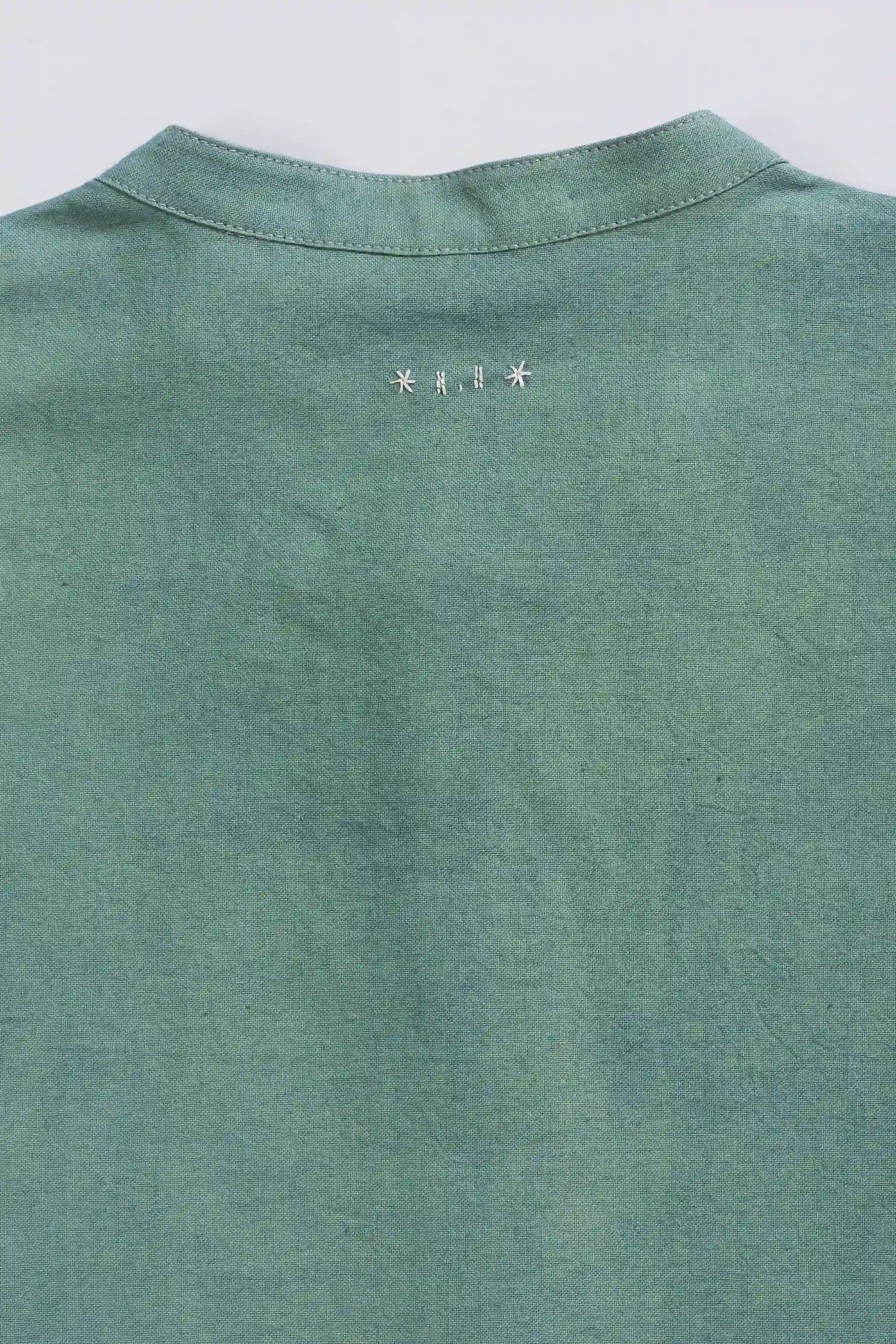 Fabric close-up with hand detailing