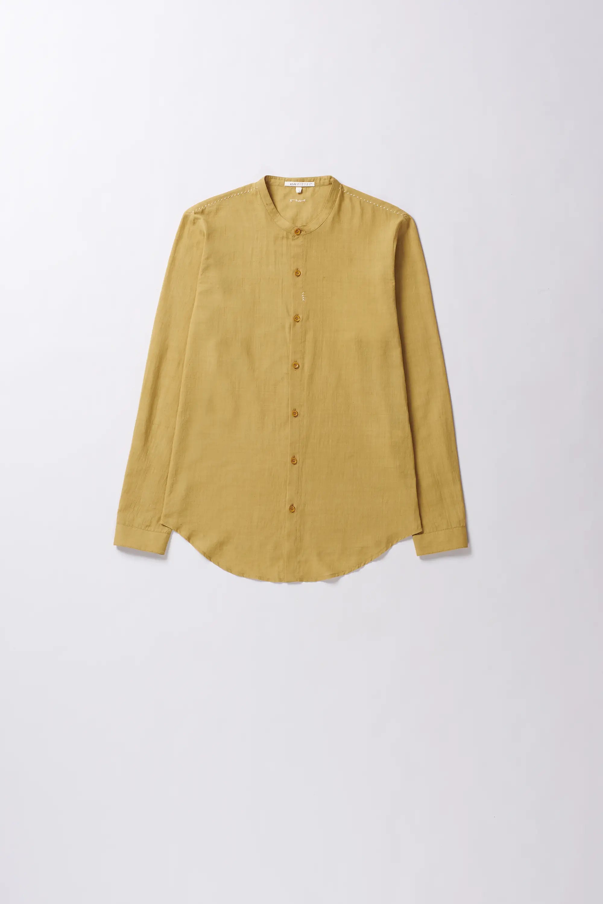 Front image of a ochre yellow cotton shirt