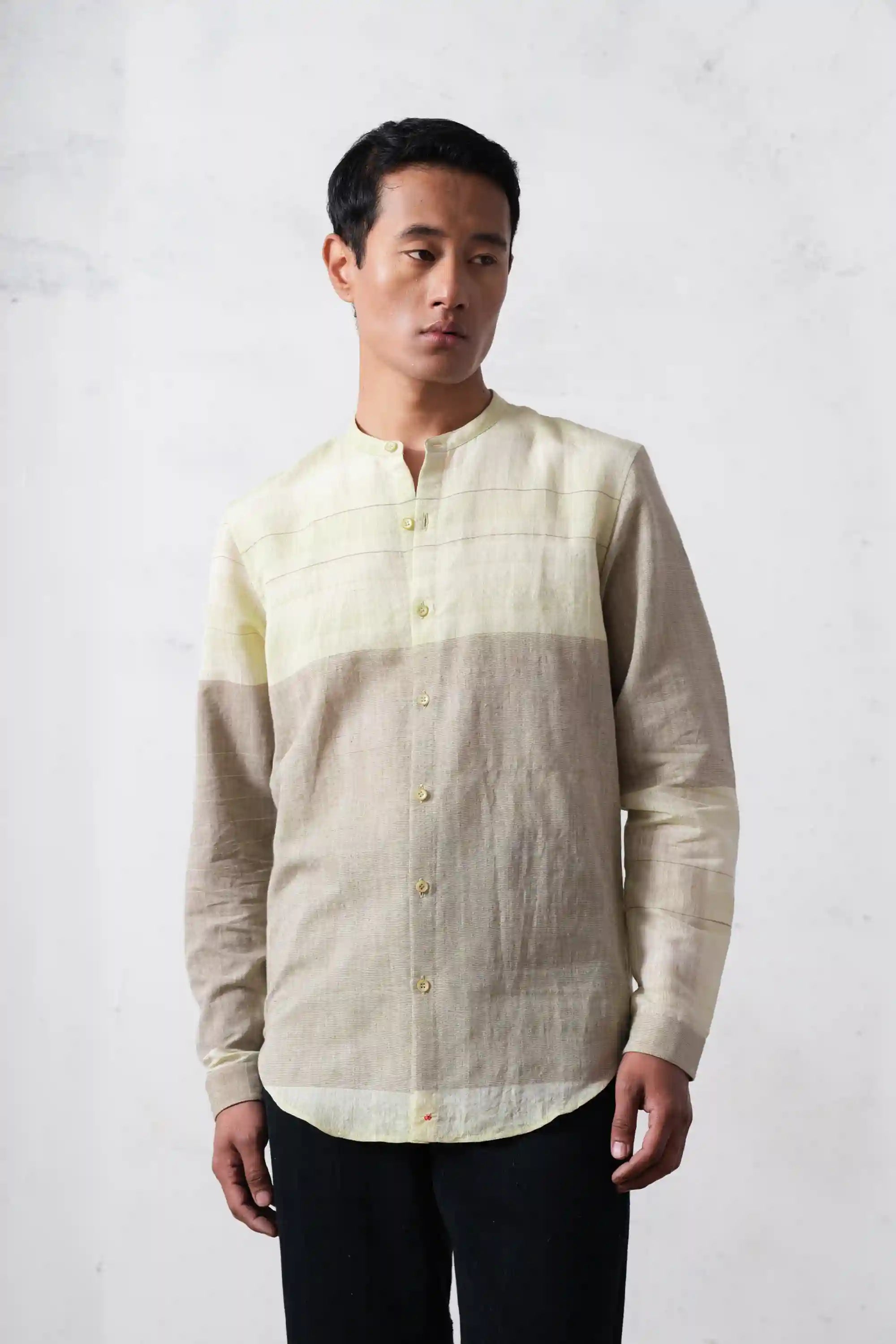 A man wearing khaki green shirt