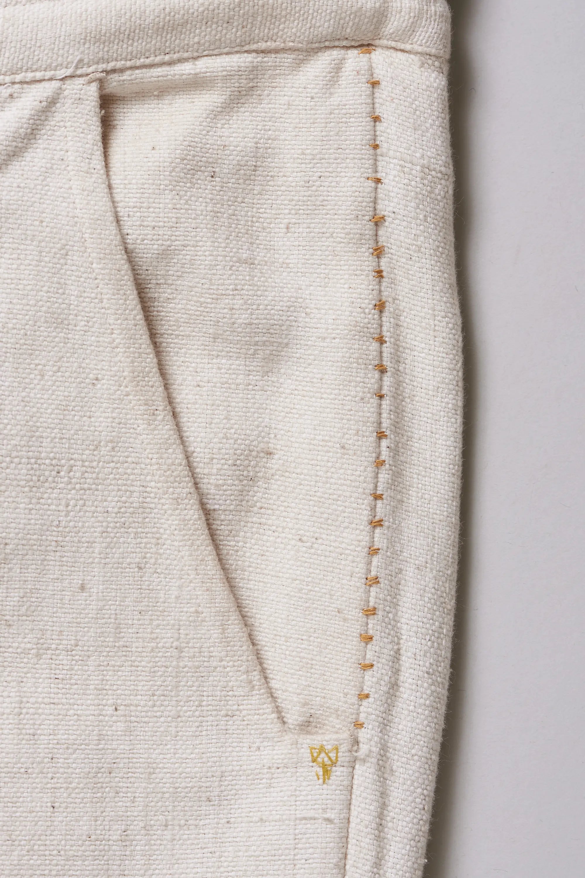 Close-up of pocket with hand detailing