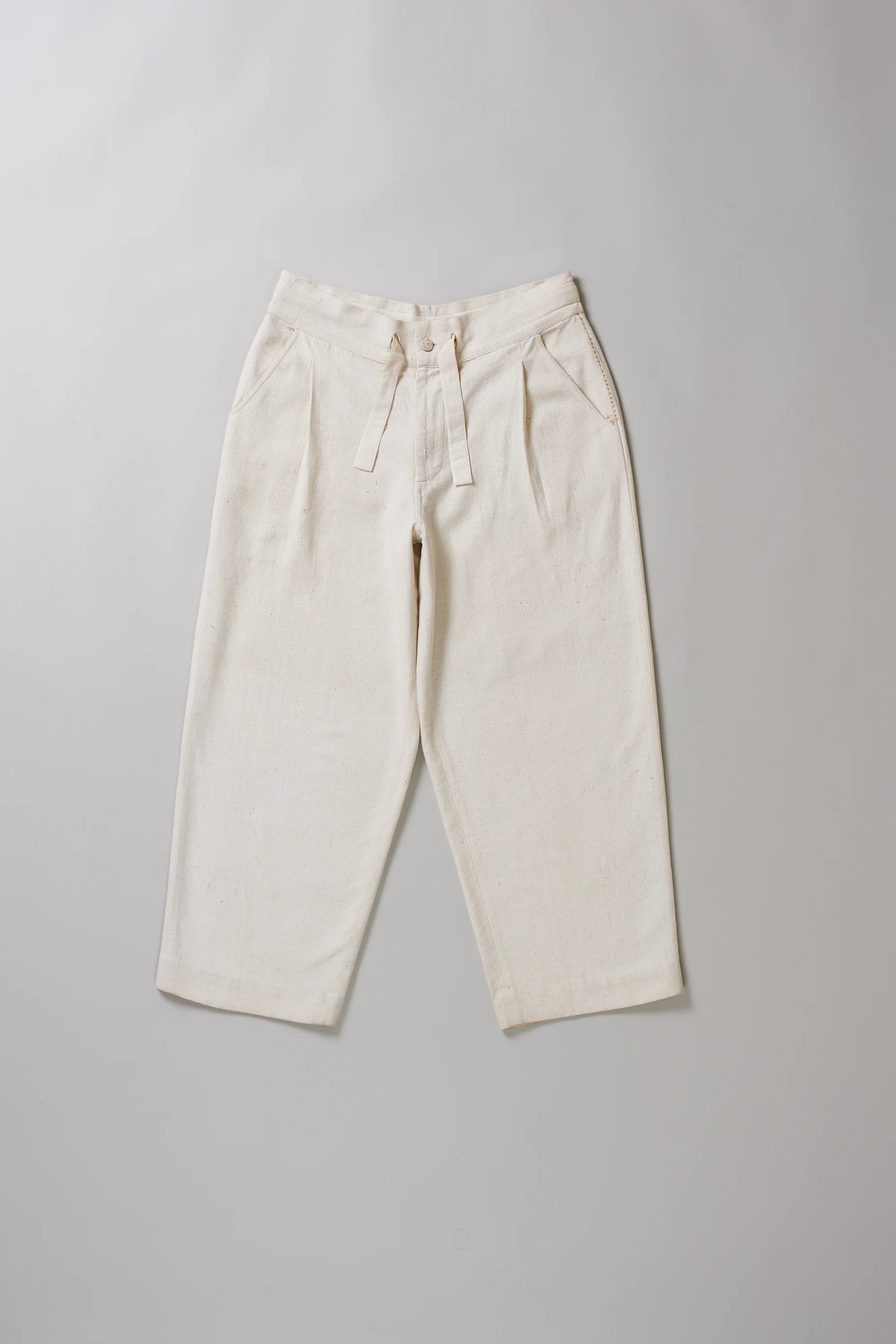Front image of ecru cotton pant