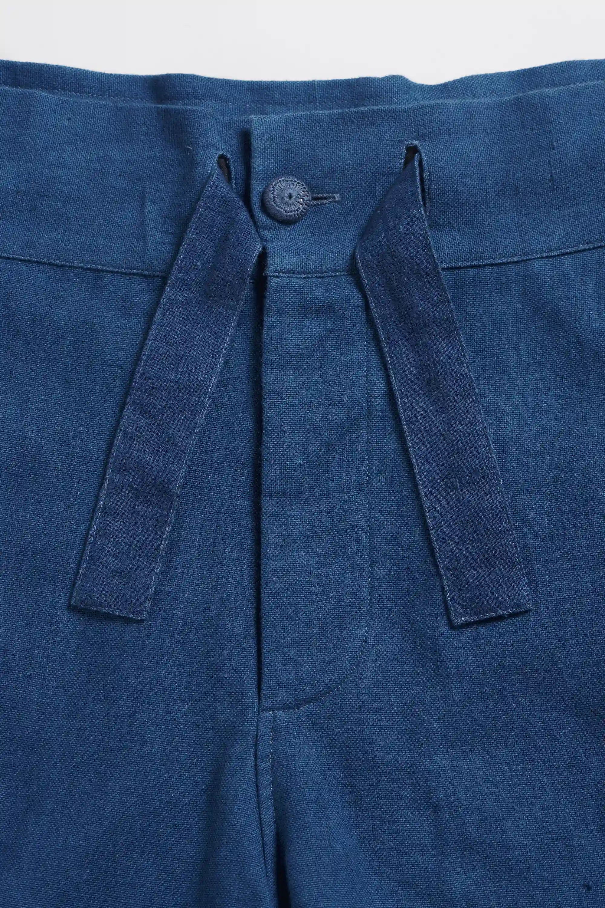 Fabric close-up with buttons and drawstring