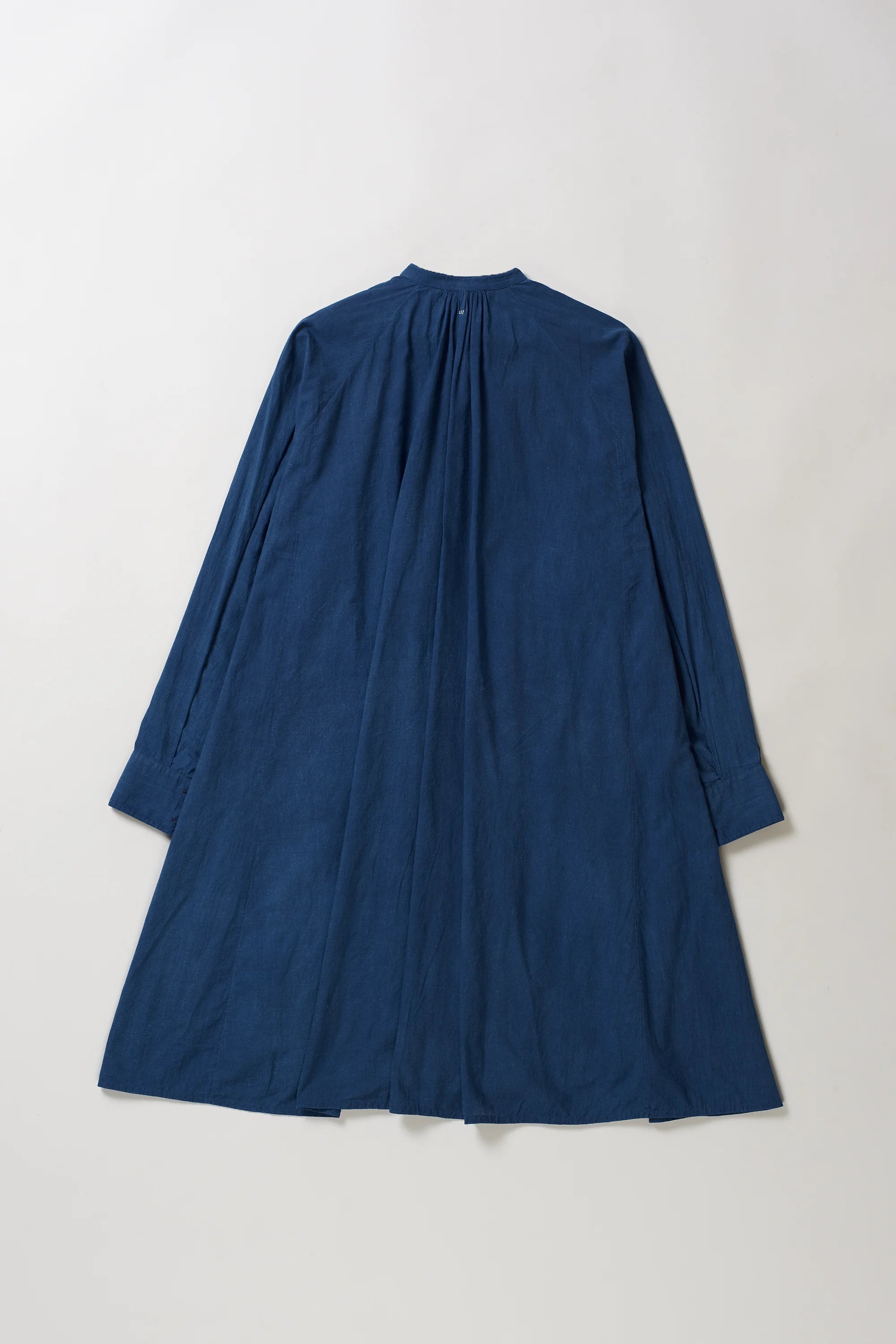 Blue dress on a light grey background