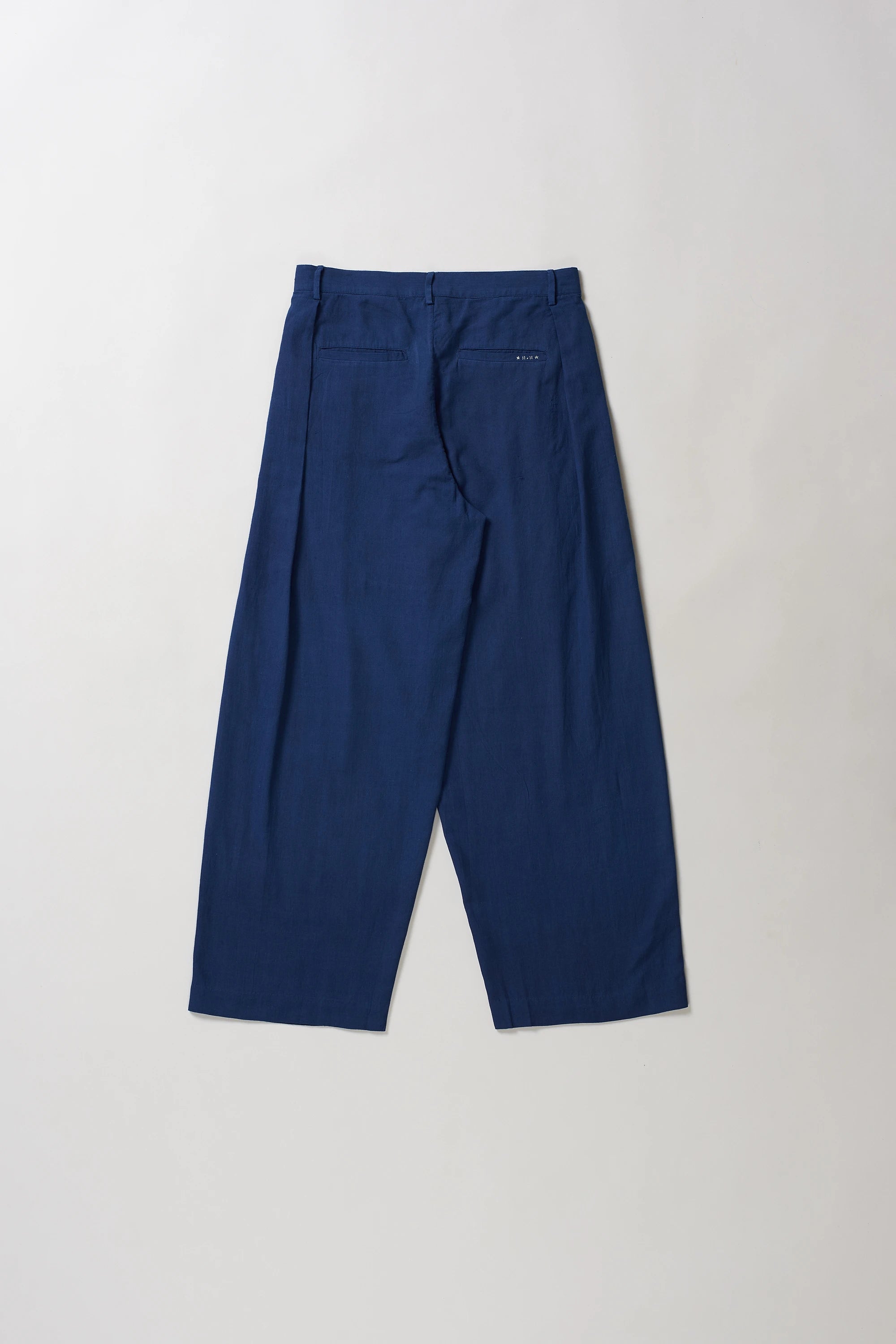 Back image of blue pants on a light grey background