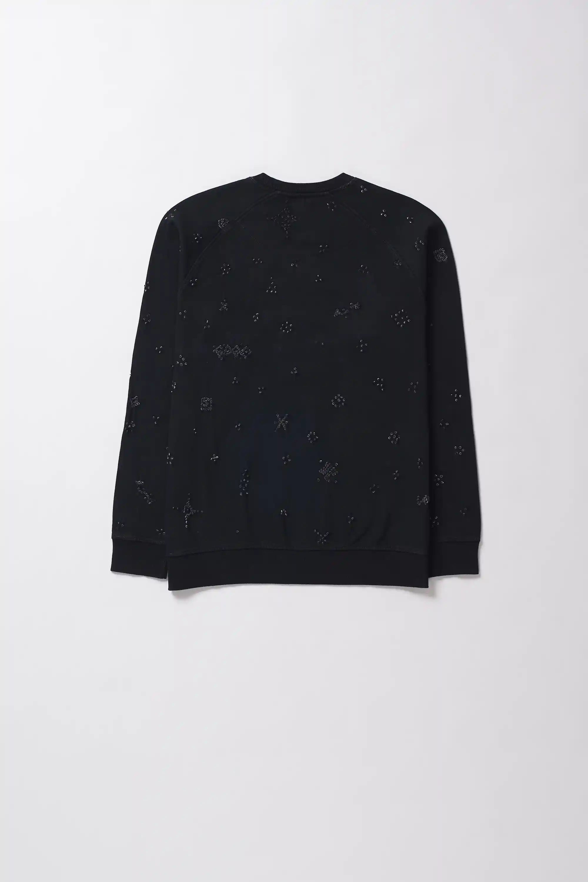 Black patterned shirt on a plain background