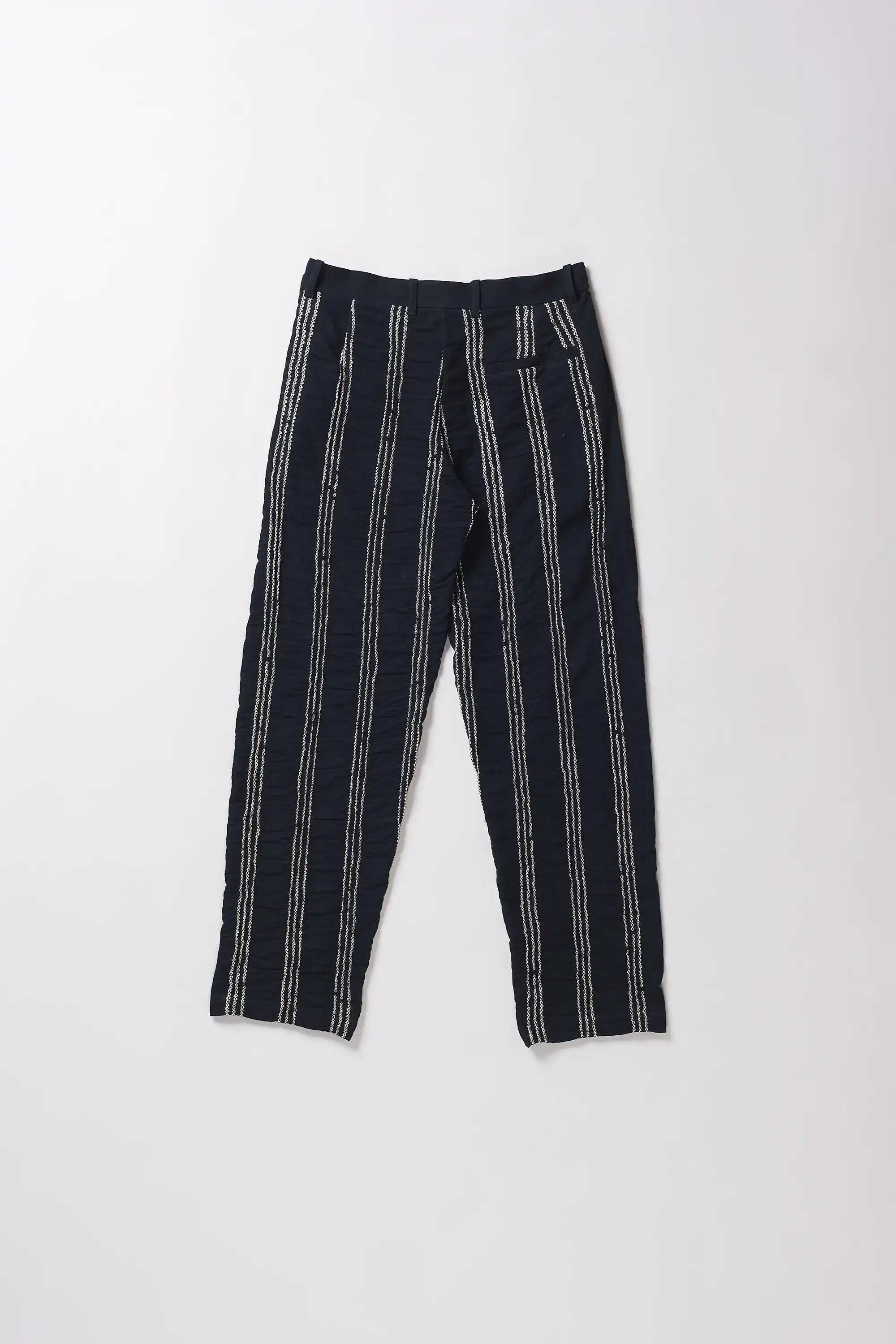 Black and white striped pants on a white background