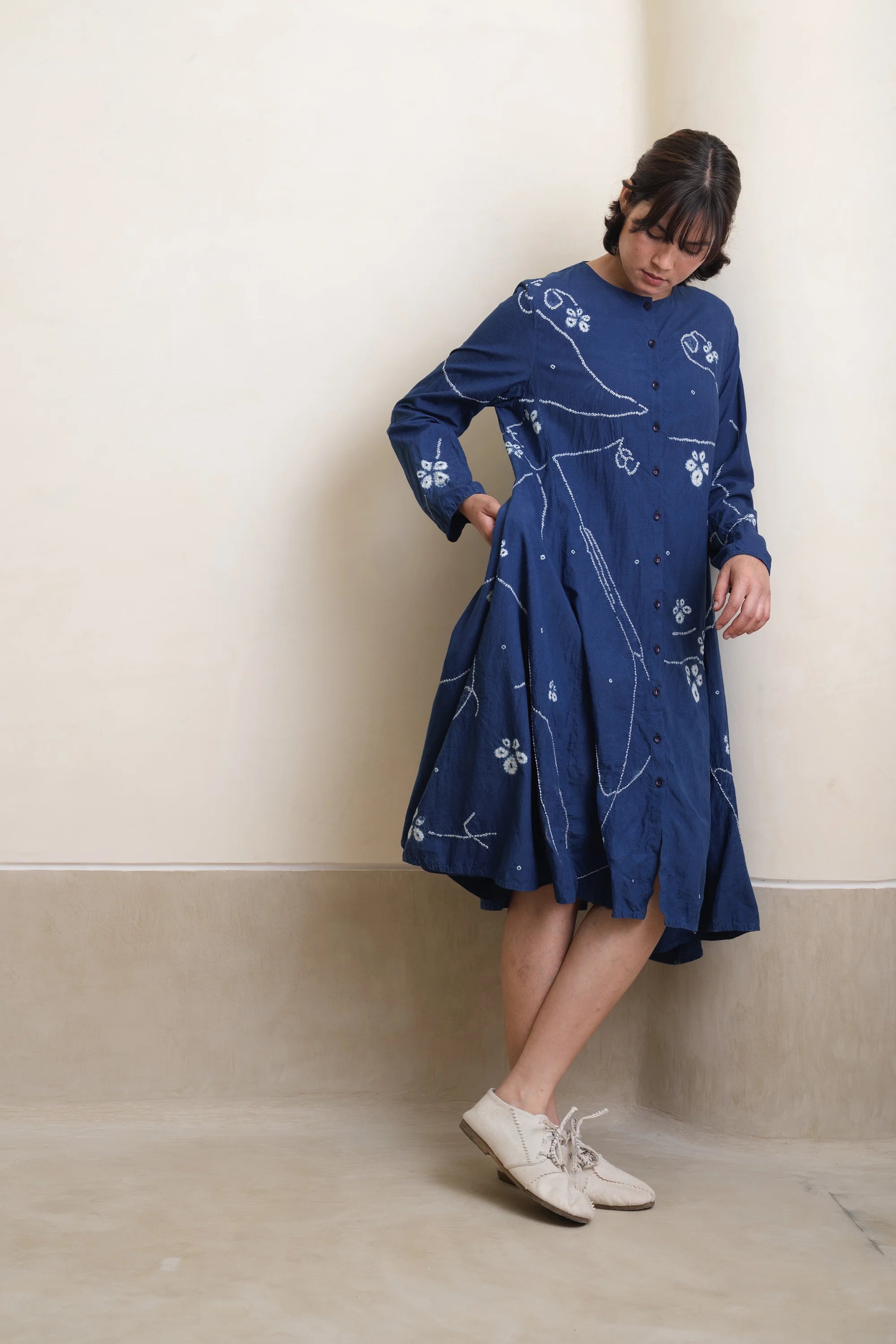 Front shot of woman model wearing indigo shibori dress