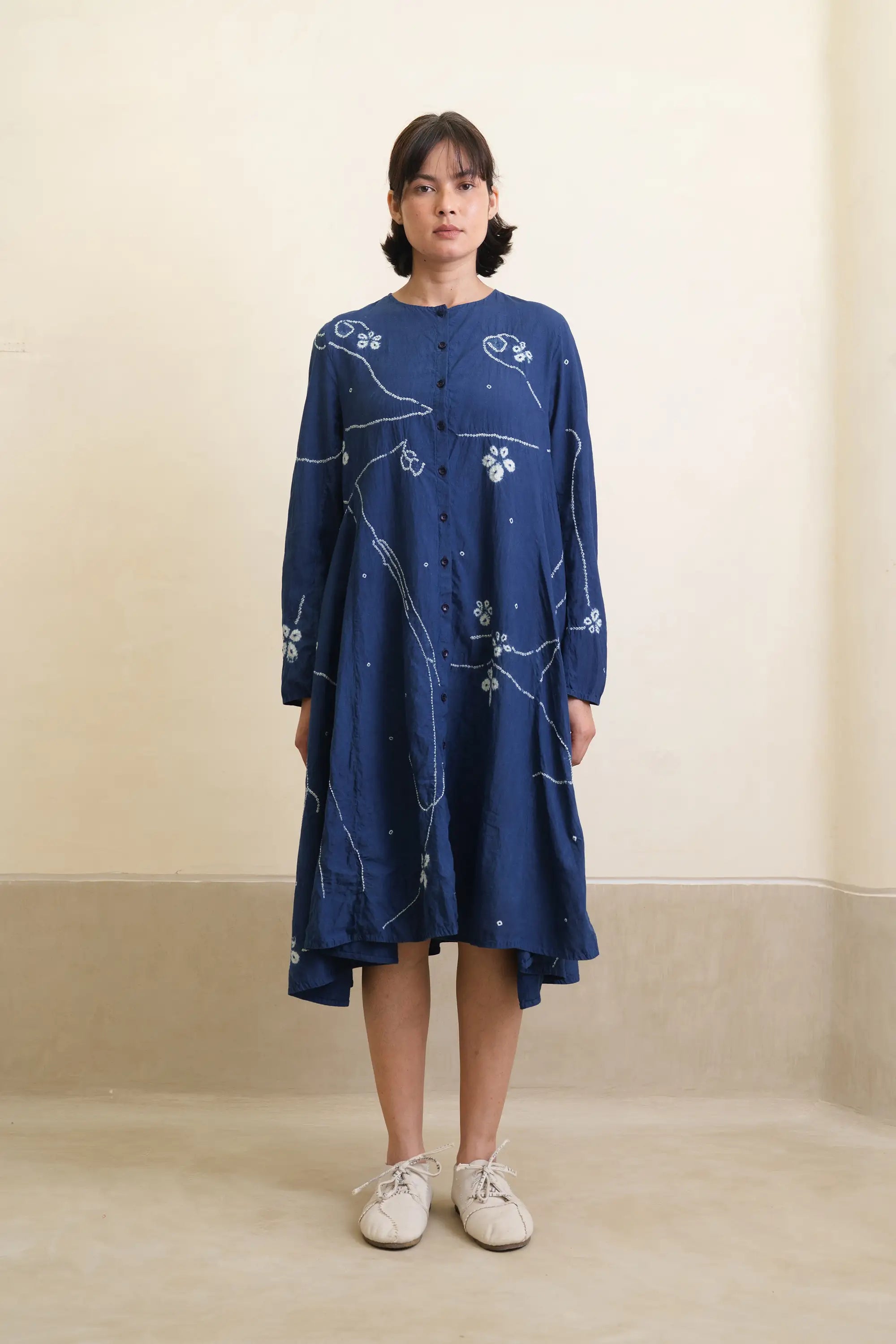 A woman wearing medium indigo dress