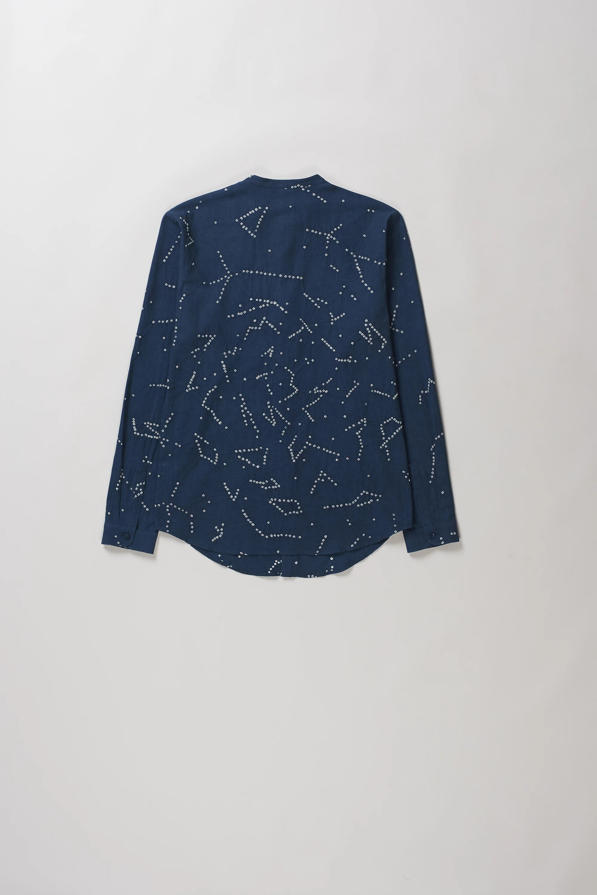 Back shot of space blue long-sleeve button-up shirt with an all-over white dotted constellation pattern.