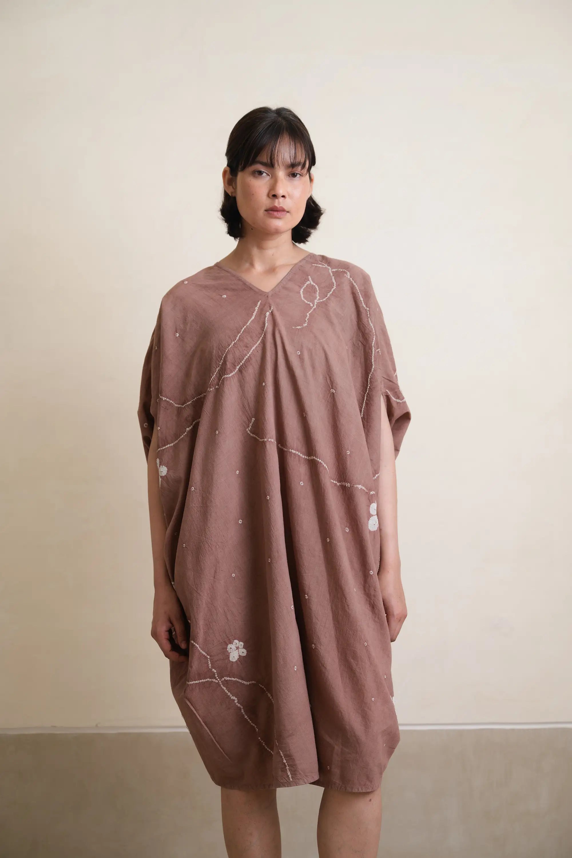 A woman wearing cotton old rose dress