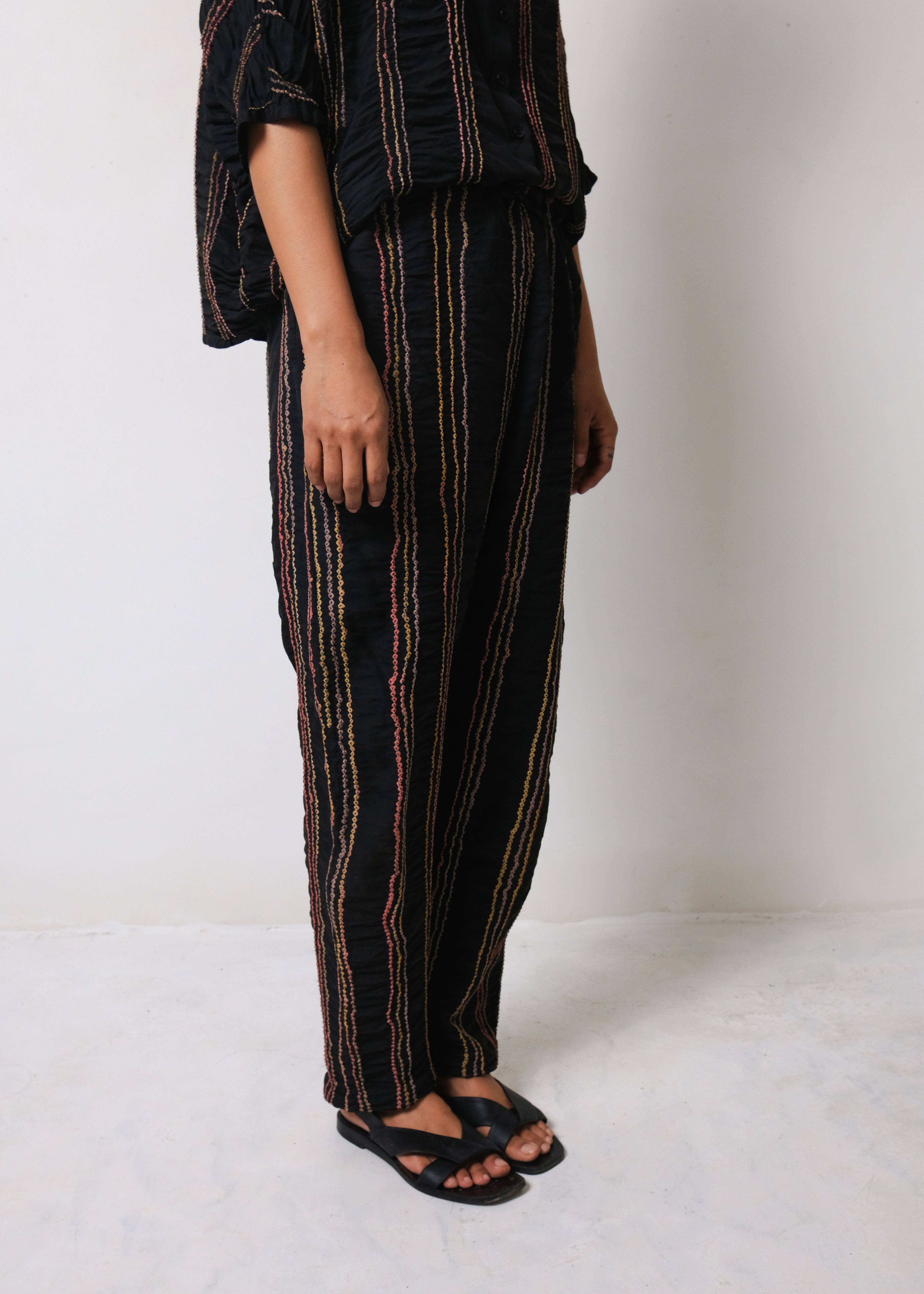 BLACK TROUSERS IN MULTI COLOURED BANDHANI STRIPES