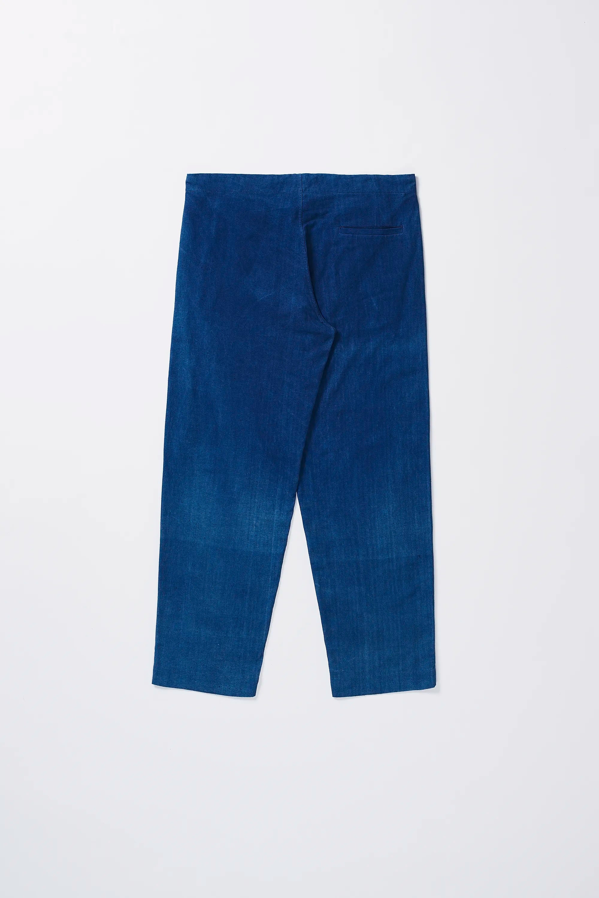 Back image of a medium indigo cotton pant with pocket