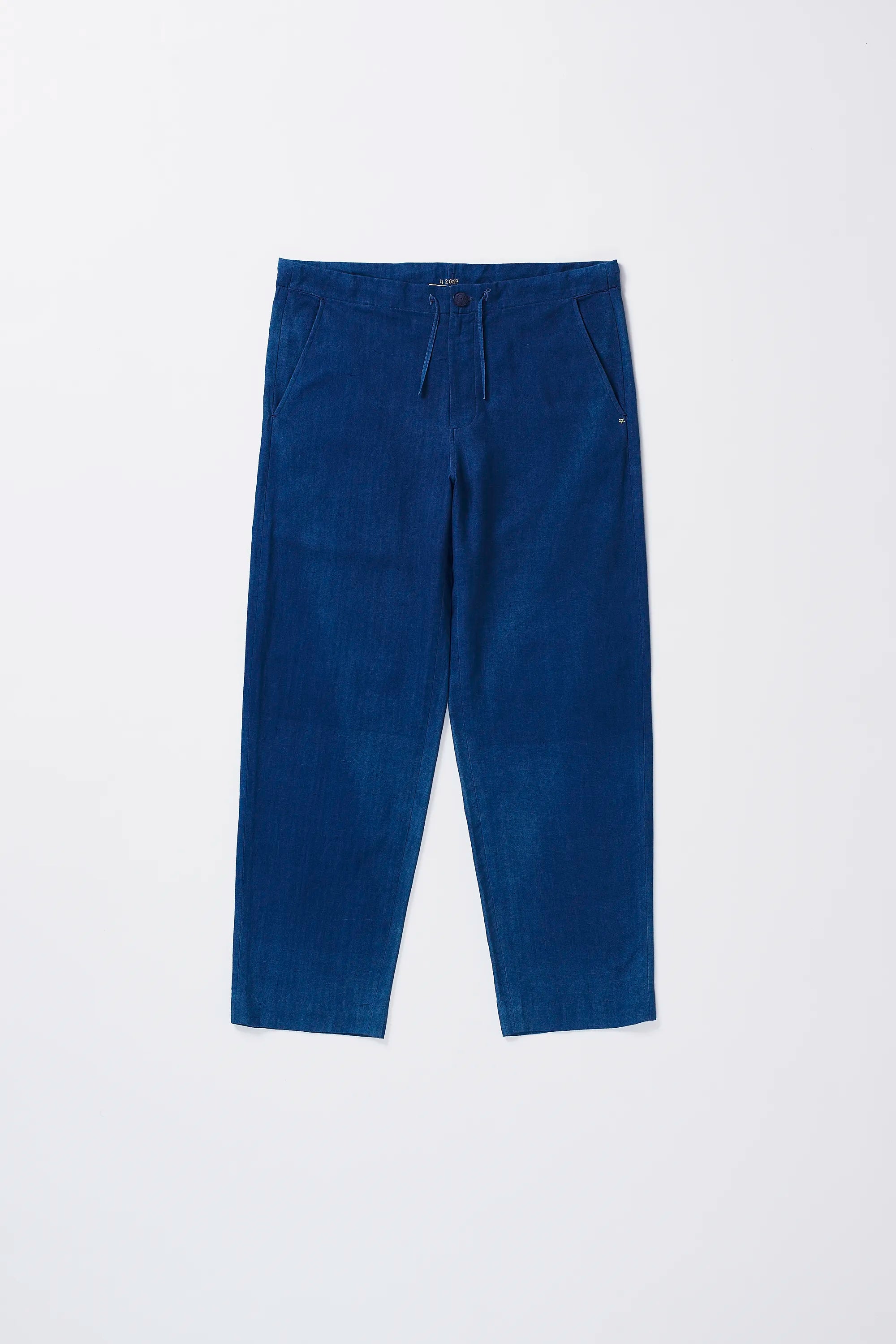 Front image of a medium indigo cotton pant with drawstring
