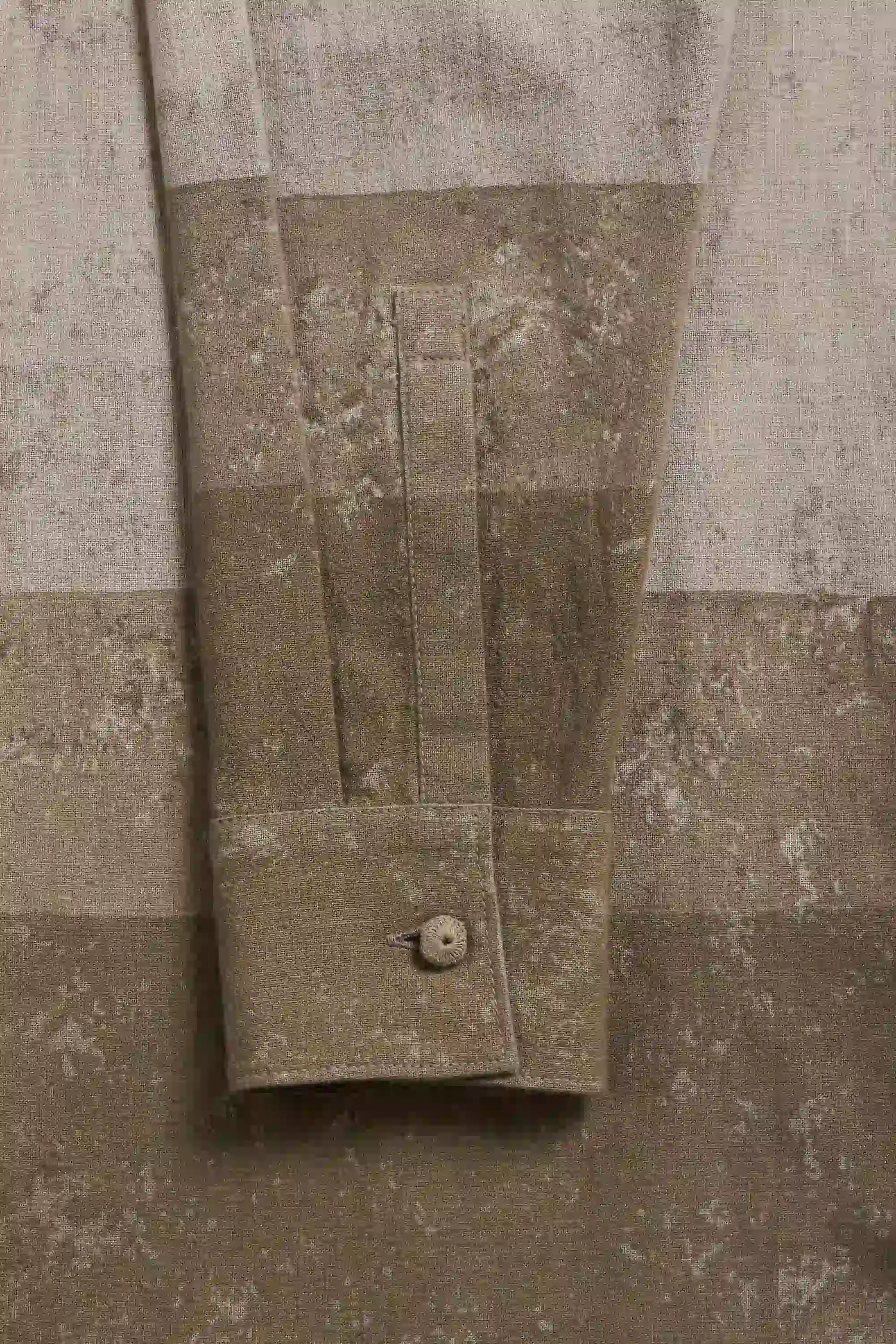 Fabric close-up of sleeve and button