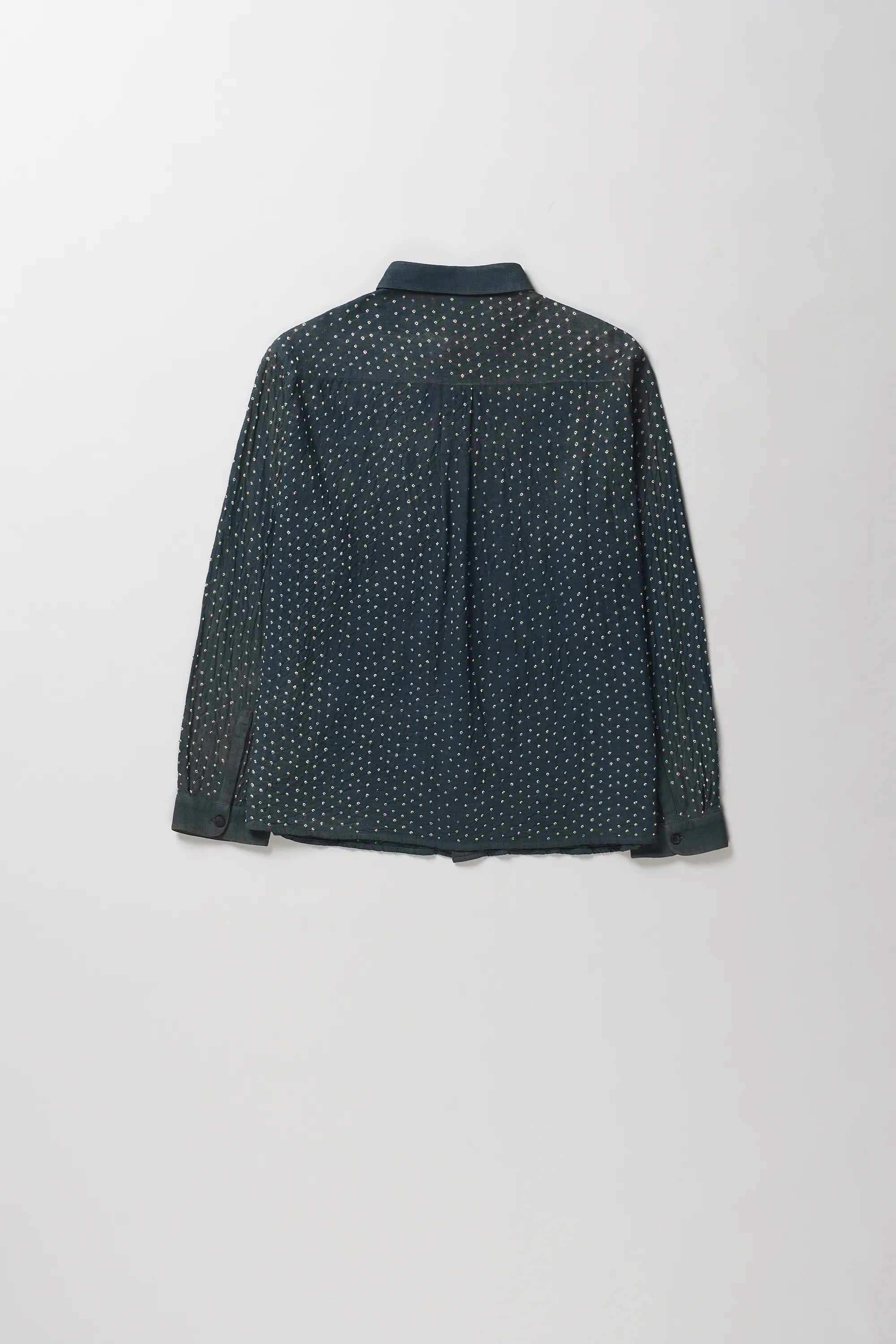 Back shot of shirt with a small white micro-dot bandhani, shown from the back against a light gray background.