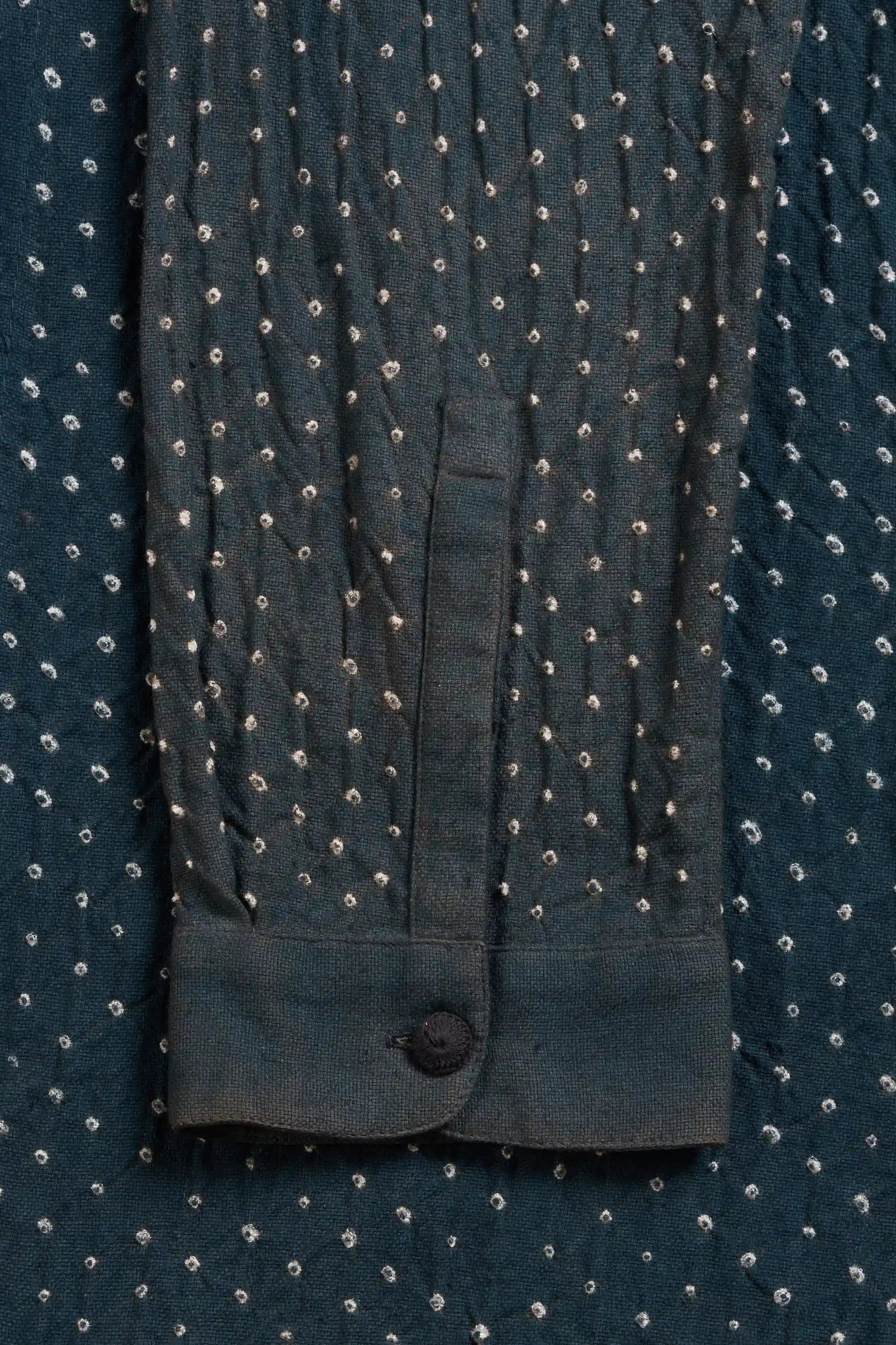 Close-up of a sleeve with a button cuff.