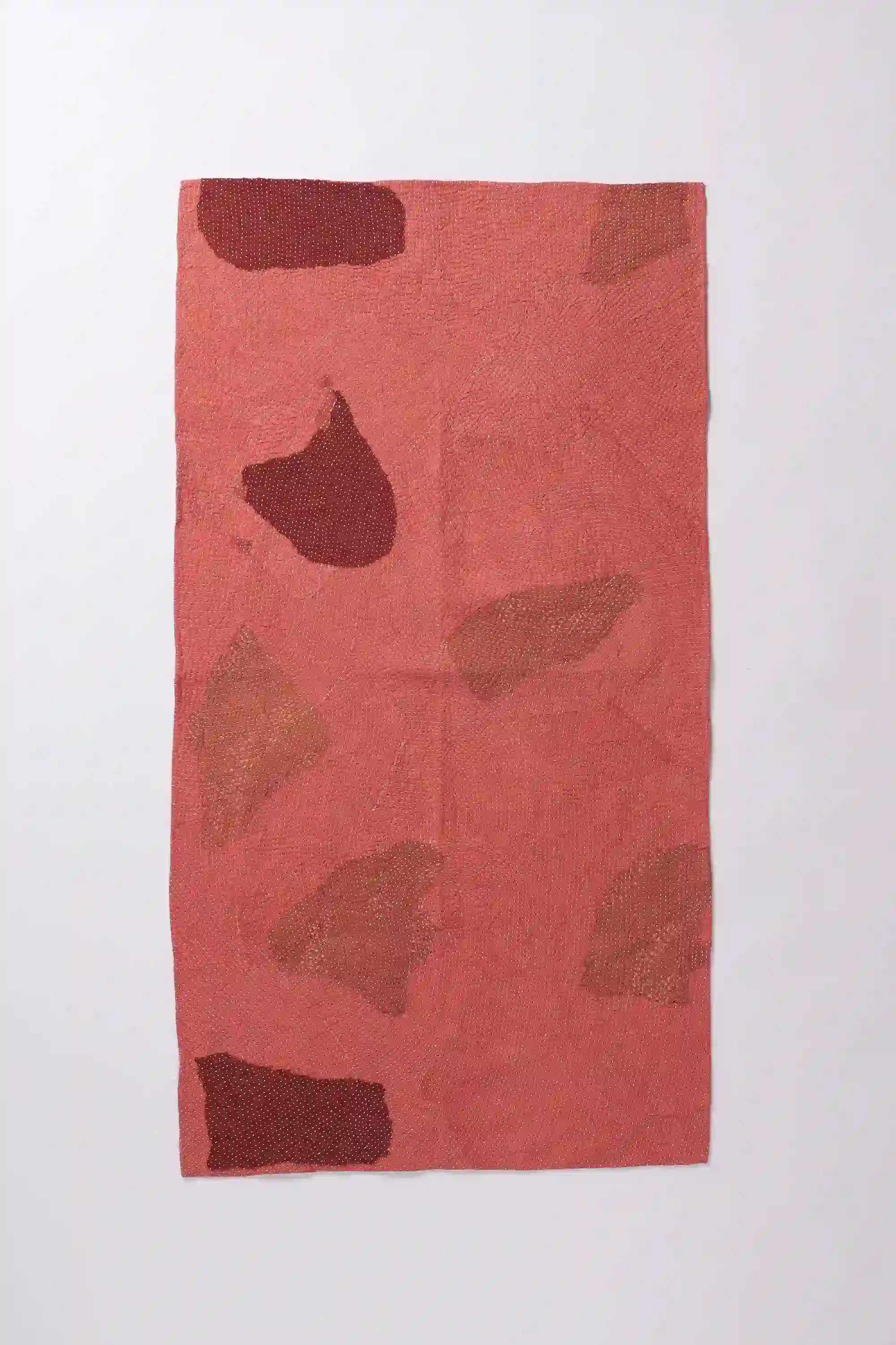 Patchwork quilt in shades of red