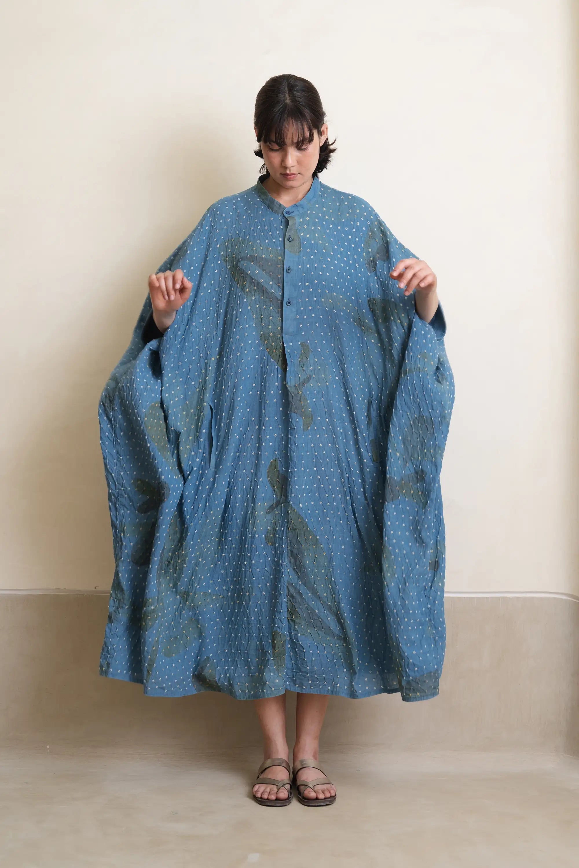 A woman wearing light indigo dress