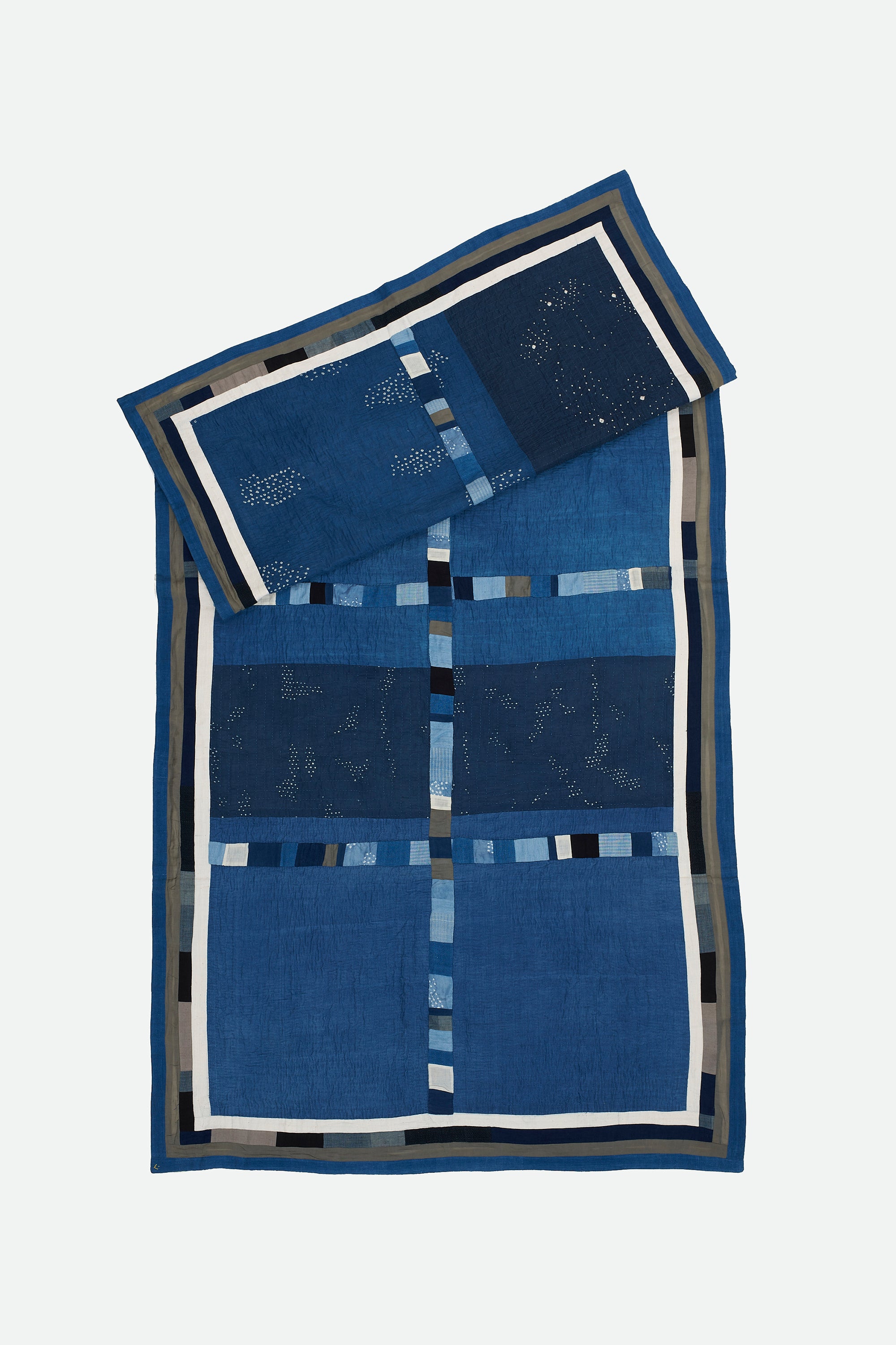 HAND EMBROIDERED PATCHWORK QUILT IN SHADES OF INDIGO