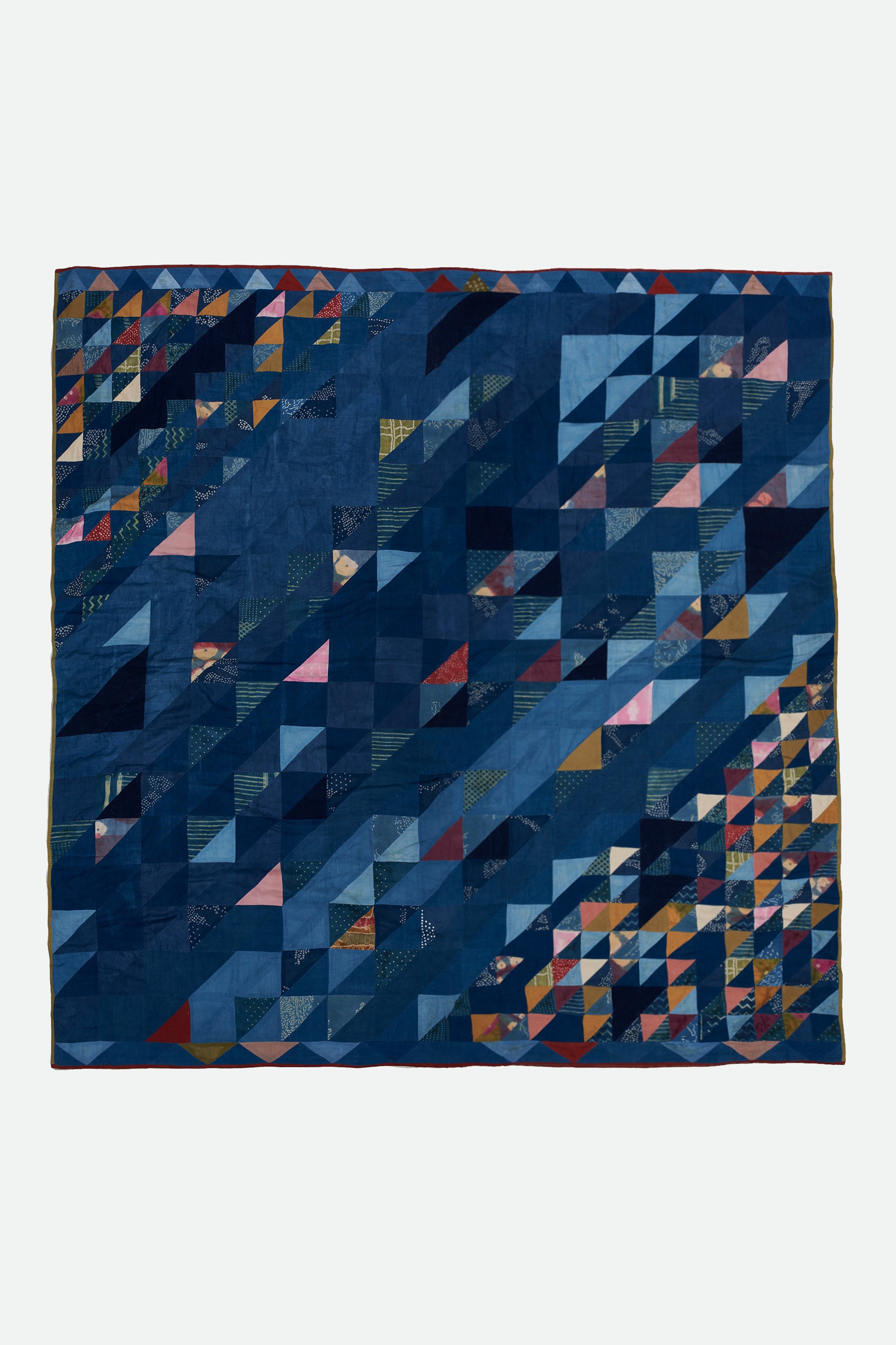 ANGULAR PATCHWORK QUILT IN SHADES OF INDIGO