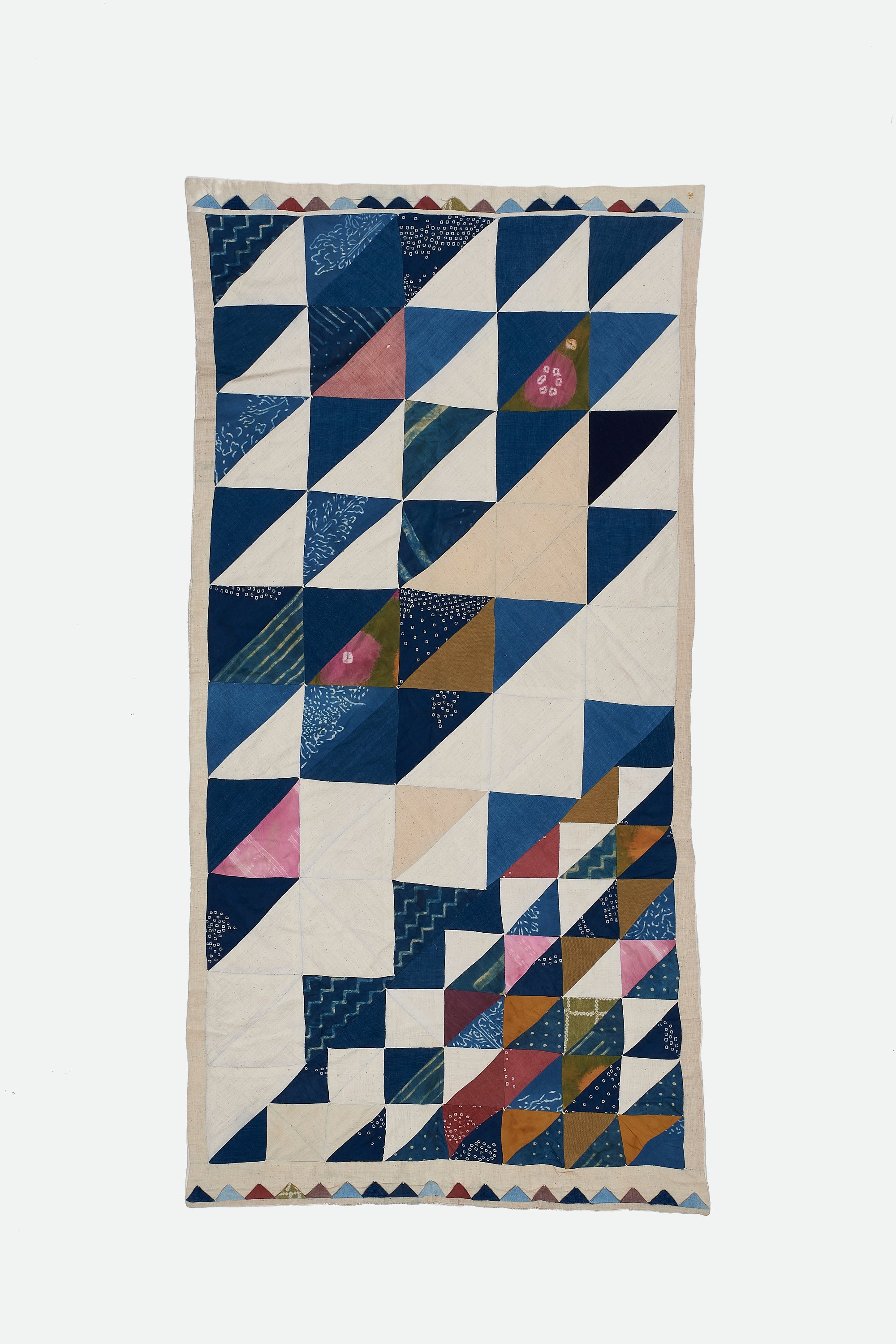 ANGULAR PATCHWORK QUILT IN SHADES OF ECRU AND INDIGO