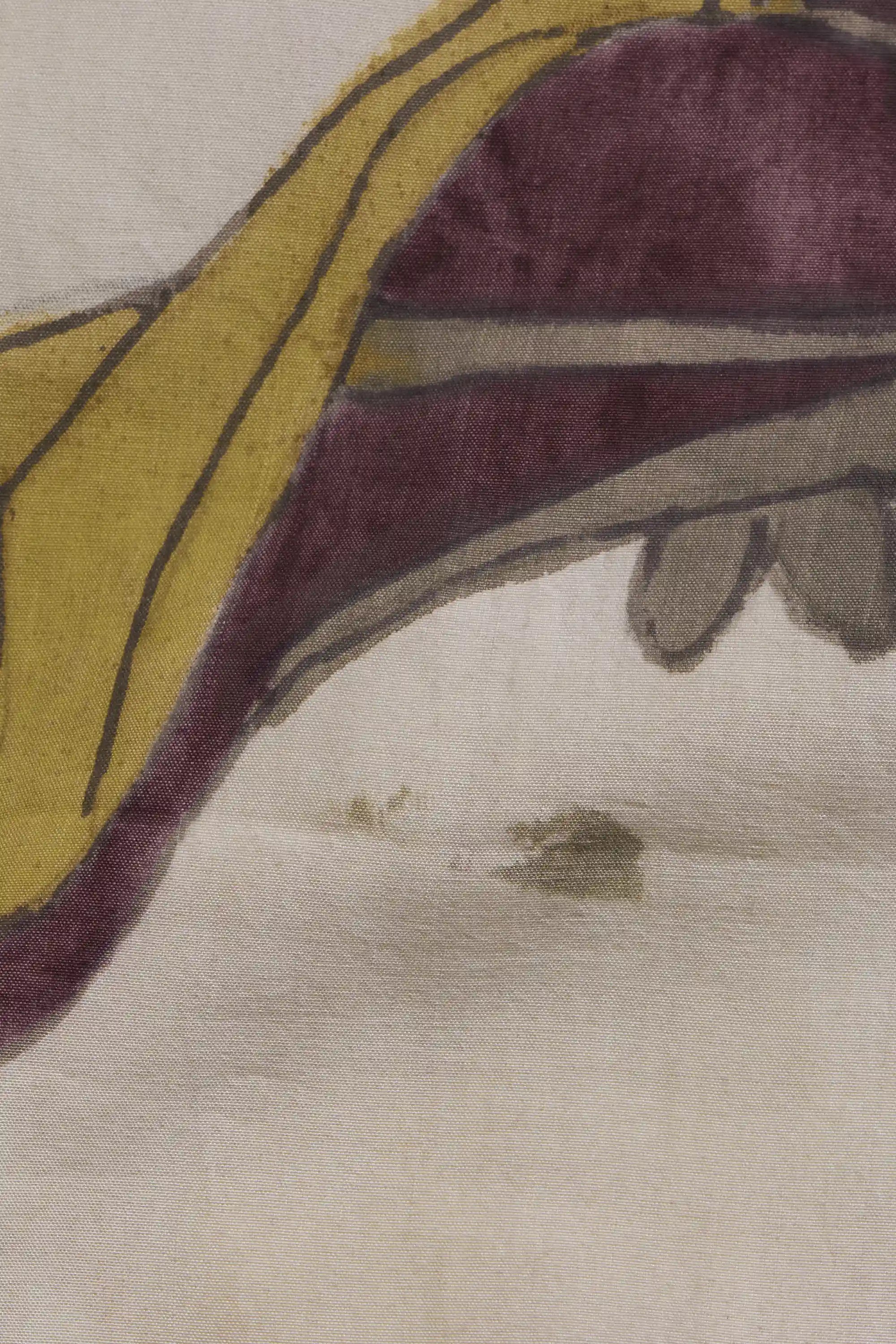 Close-up of a fabric with a purple and yellow pattern