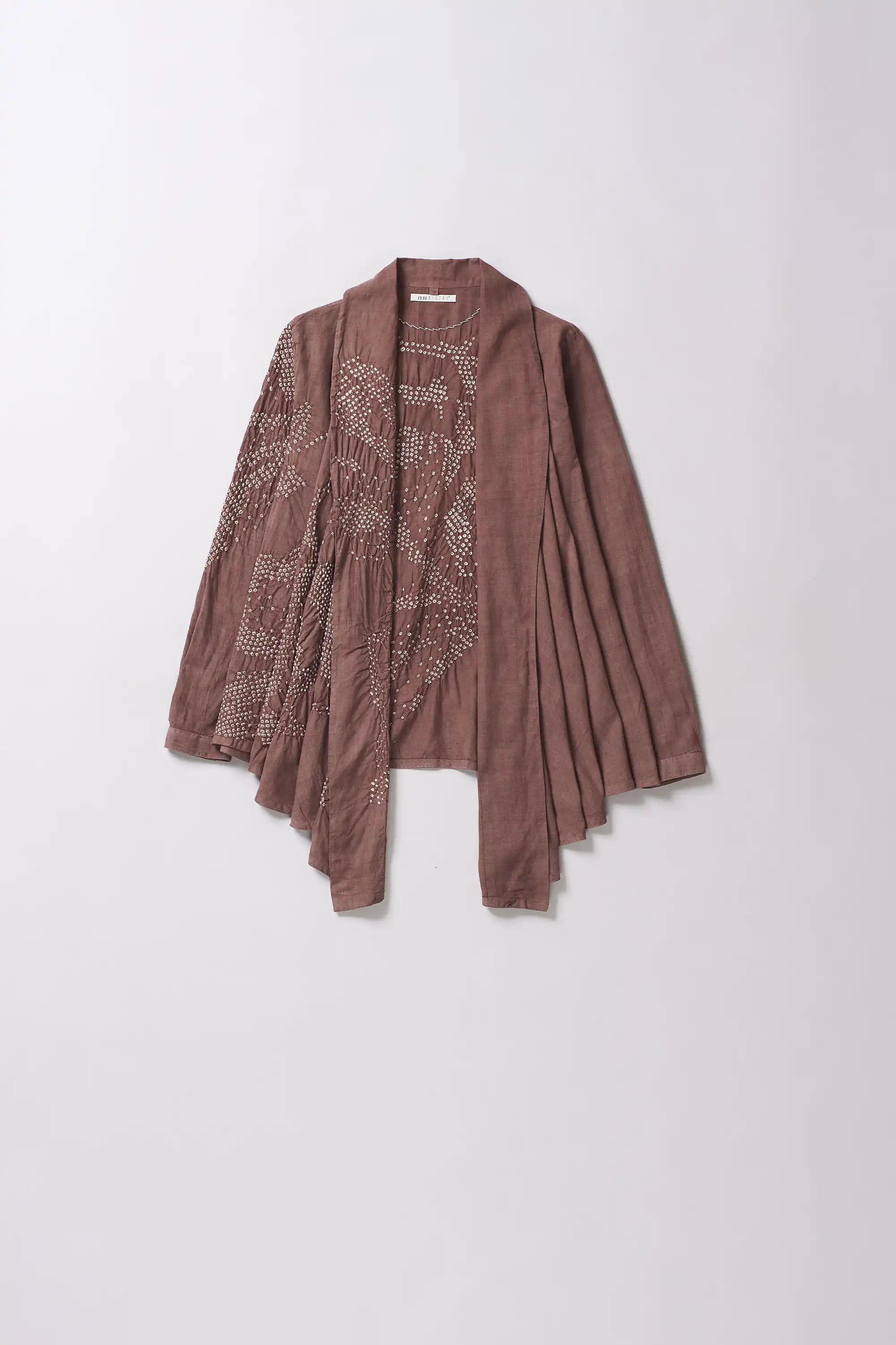 Front image of a old rose cotton shrug