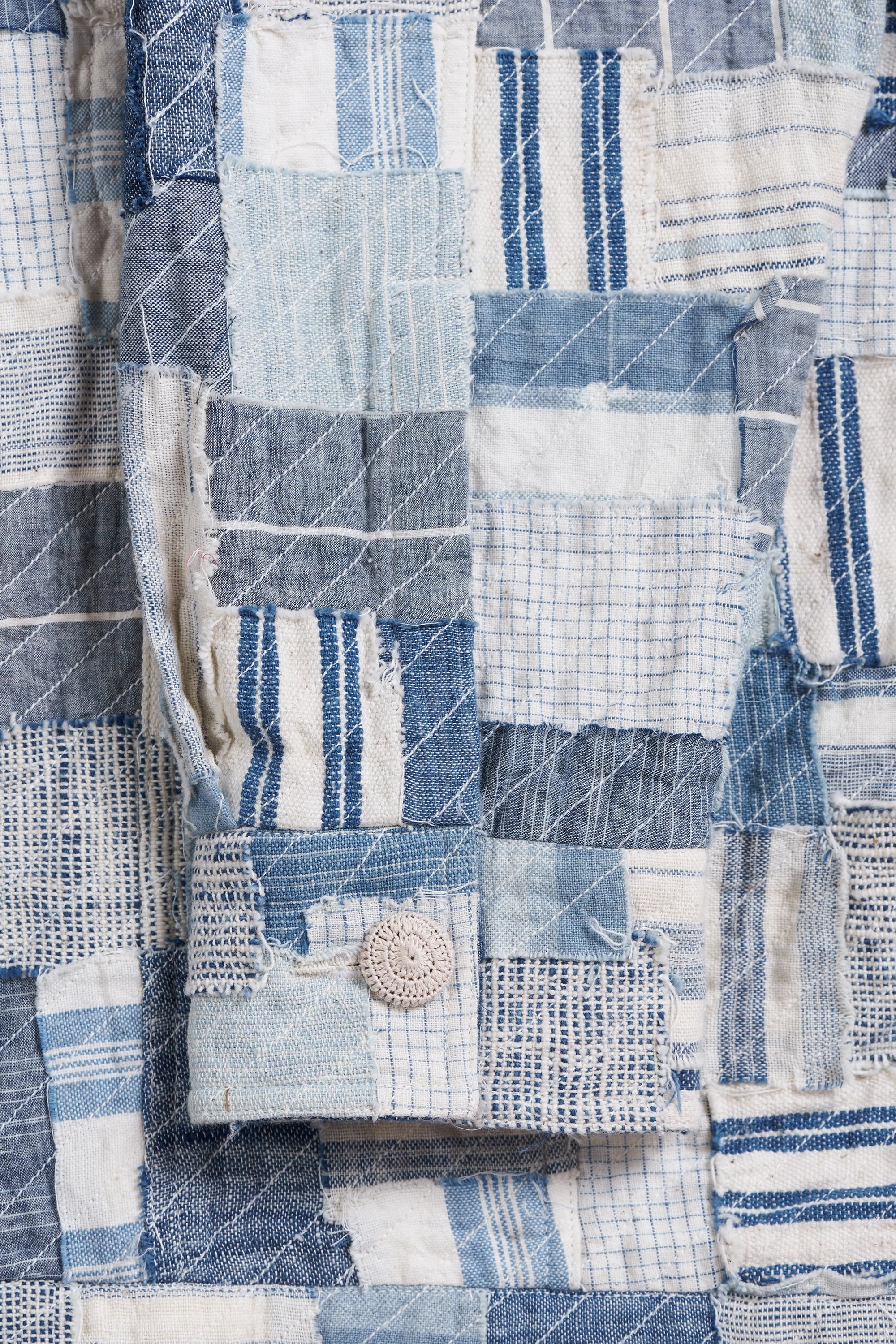 Close-up of a patchwork fabric with blue and white patterns