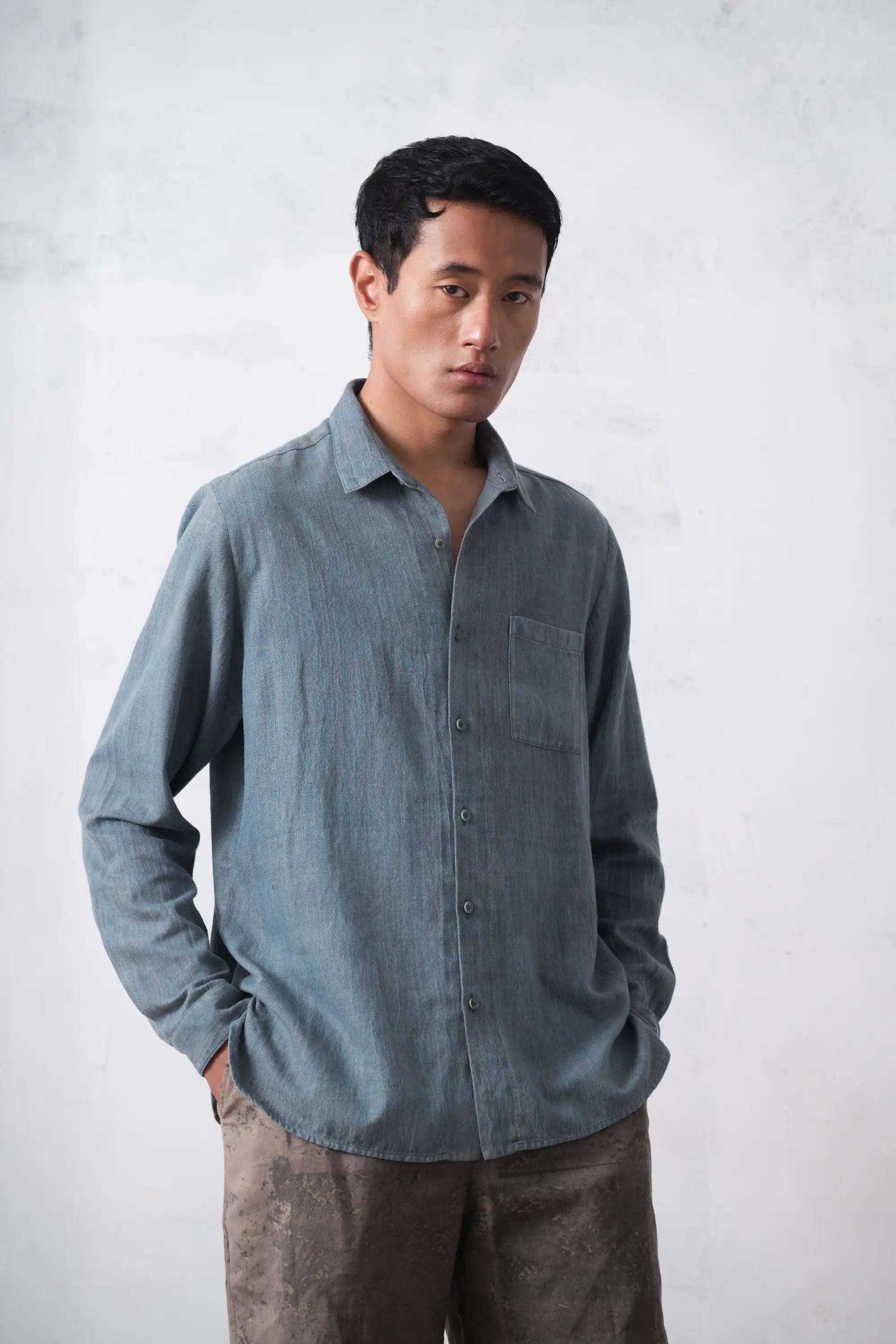 A man wearing sky indigo cotton shirt