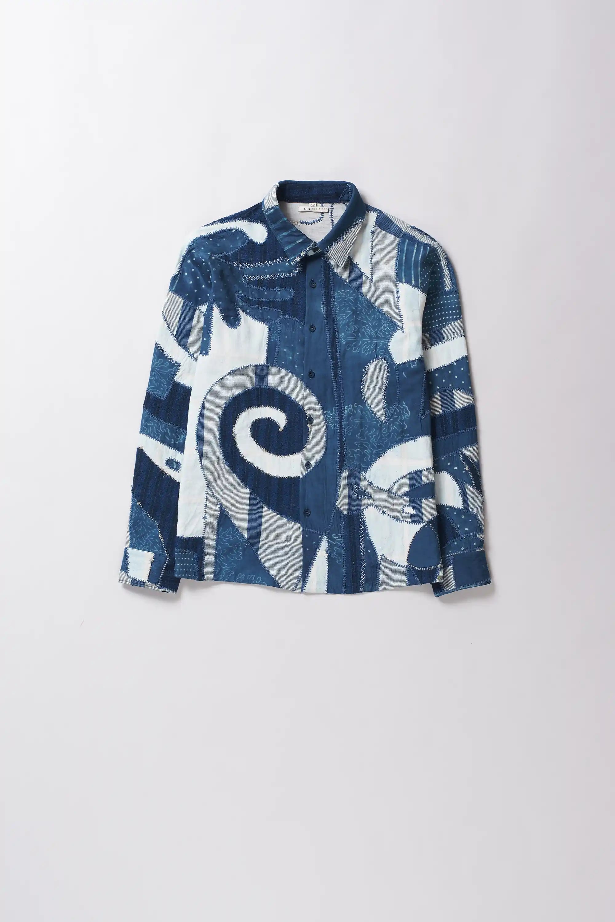 Front shot of shirt with patchwork in shades of indigo