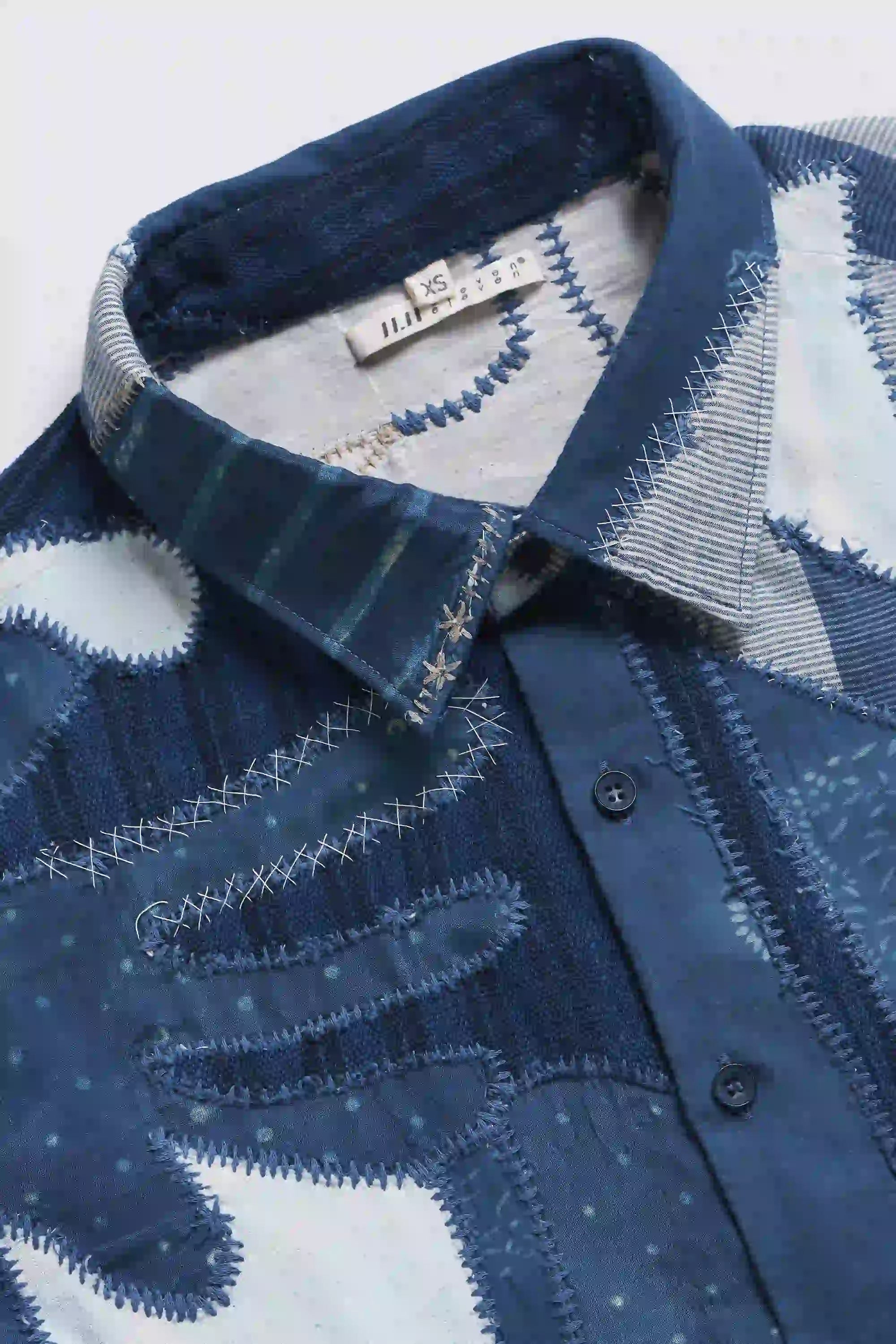 Close-up of fabric with collar and buttons