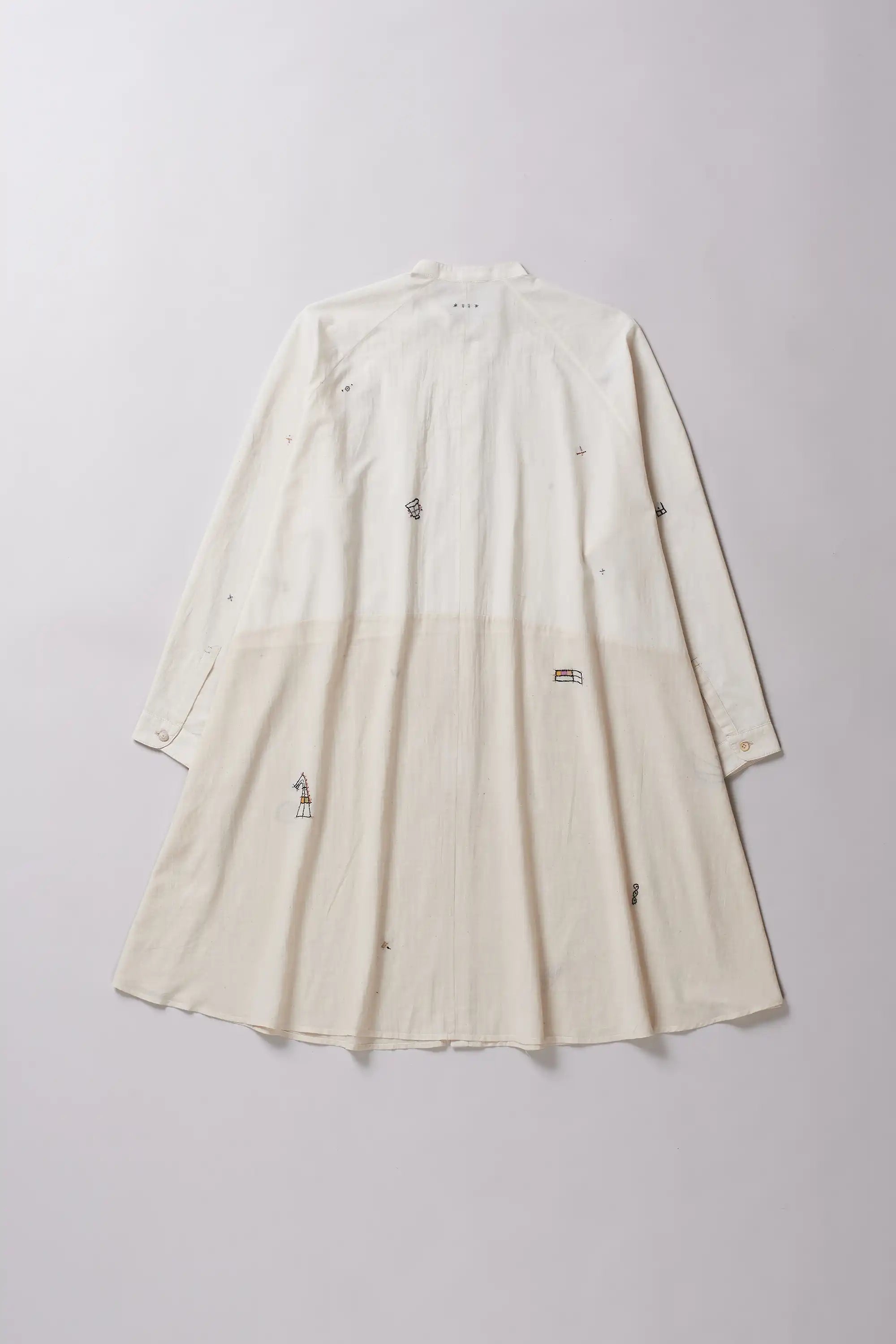 Back shot of ecru cotton dress