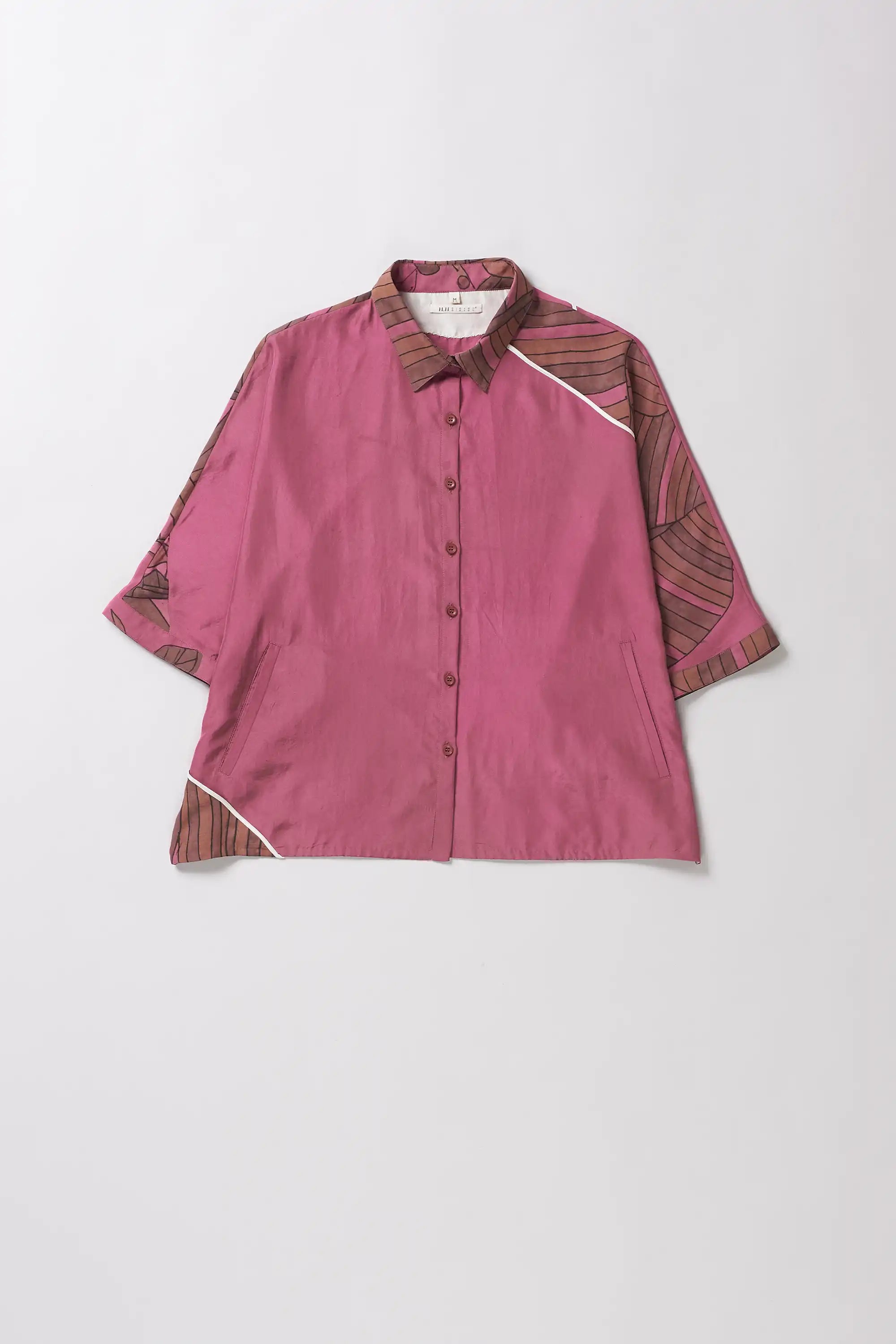 Front image of a fuchsia pink silk shirt