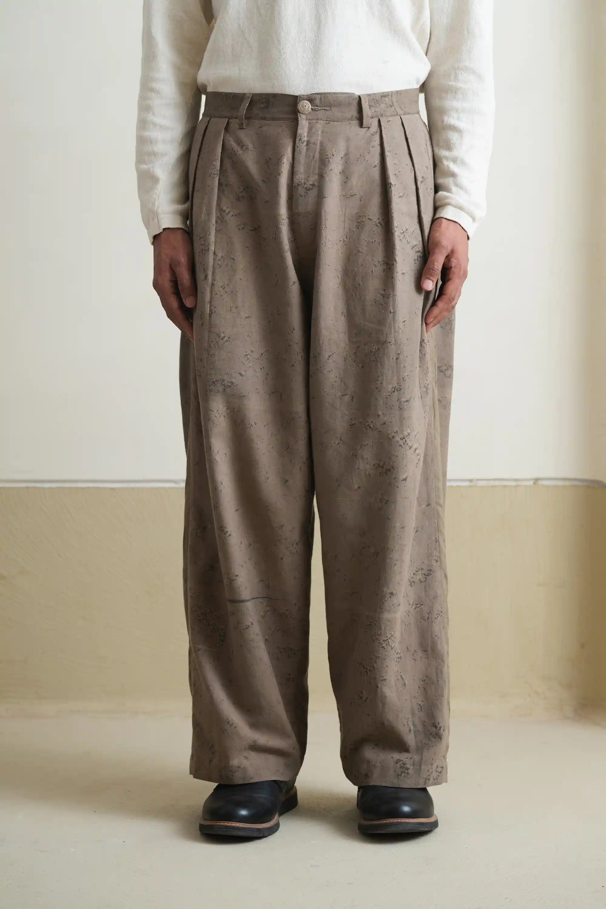 A man wearing khaki green pant
