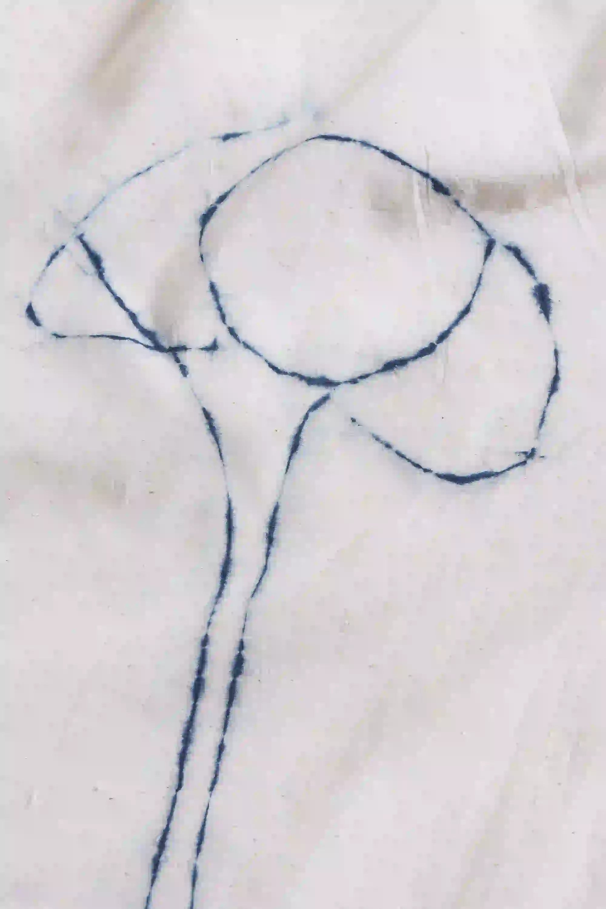Blue line drawing of a spoon on a white fabric background
