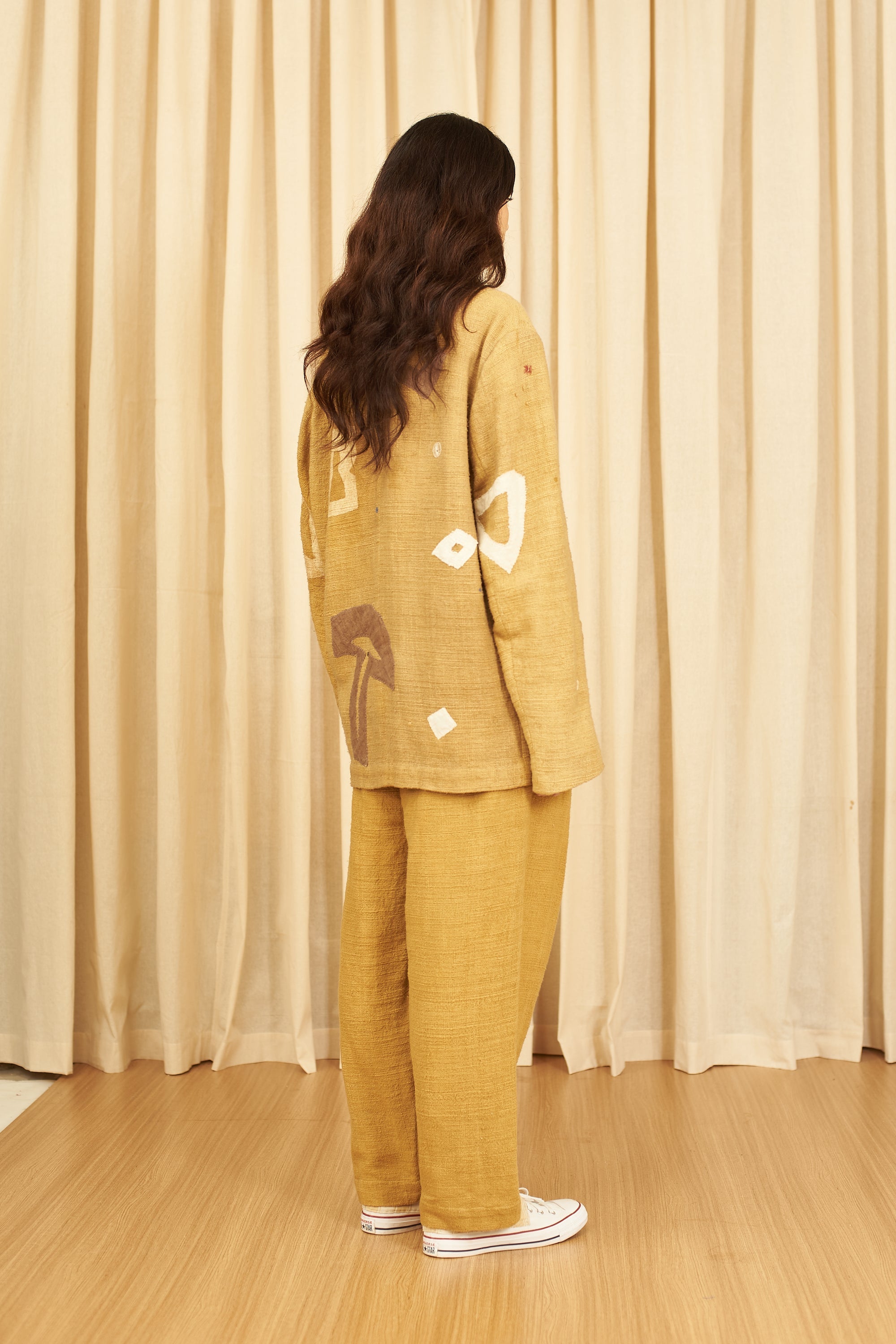 MUSTARD YELLOW TEXTURED PLEATED TROUSERS