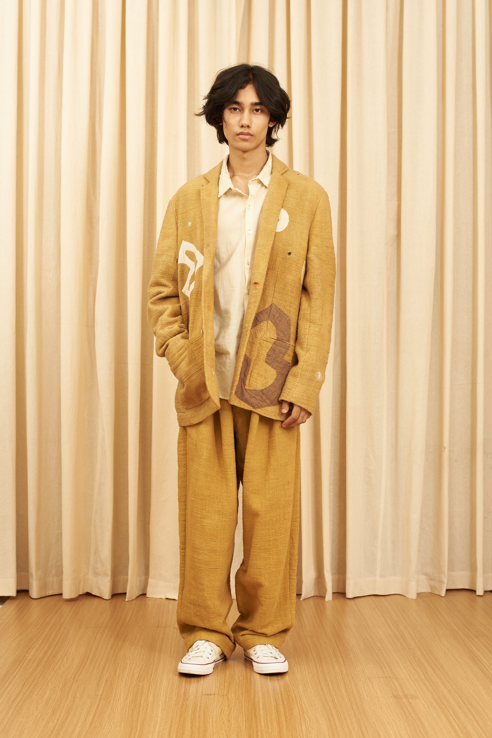 MUSTARD YELLOW TEXTURED PLEATED TROUSERS